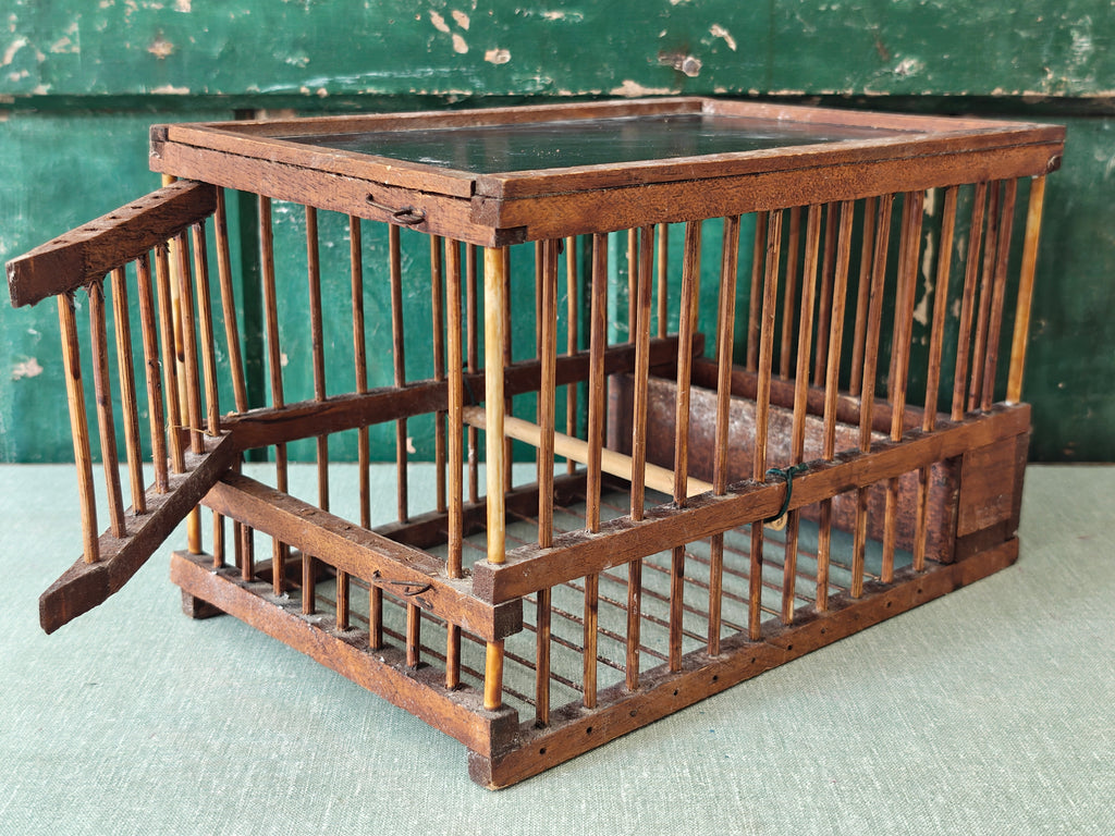 Wooden bird cage with door open