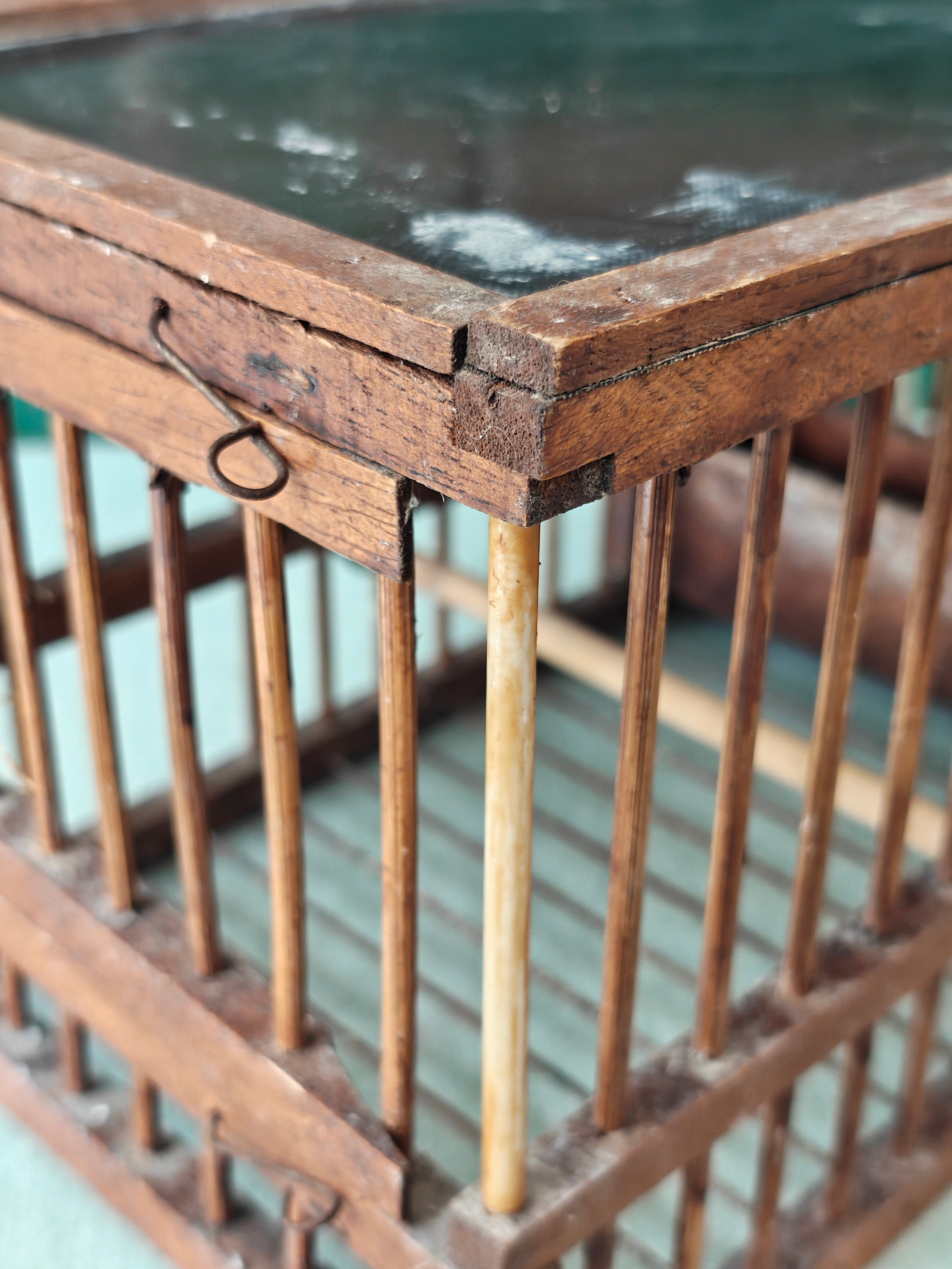 Close-up of an old wooden birdcage
