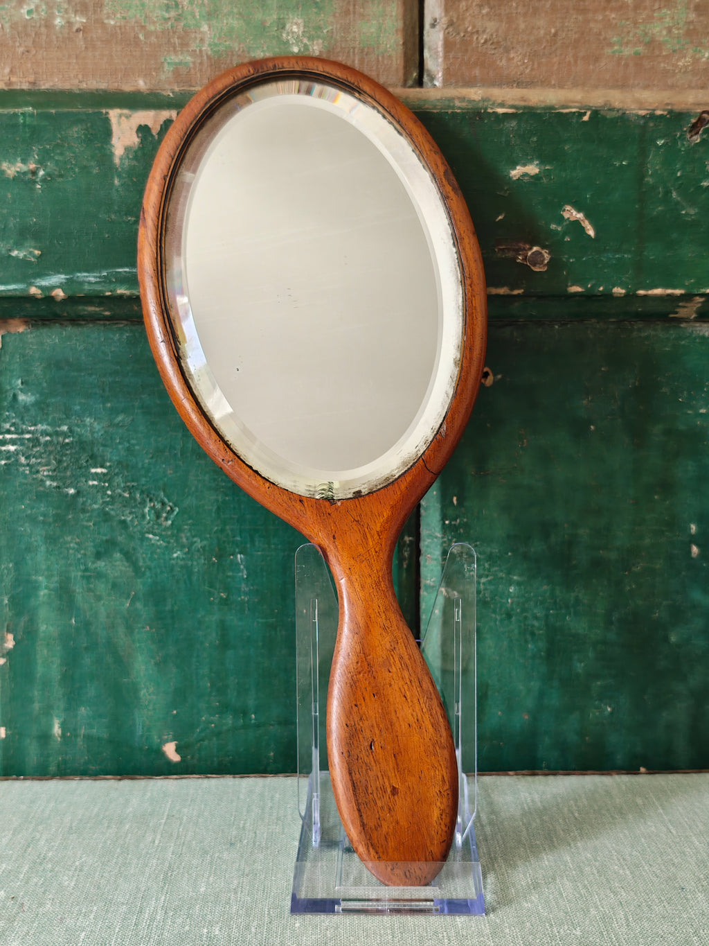 Antique wooden oval hand mirror 