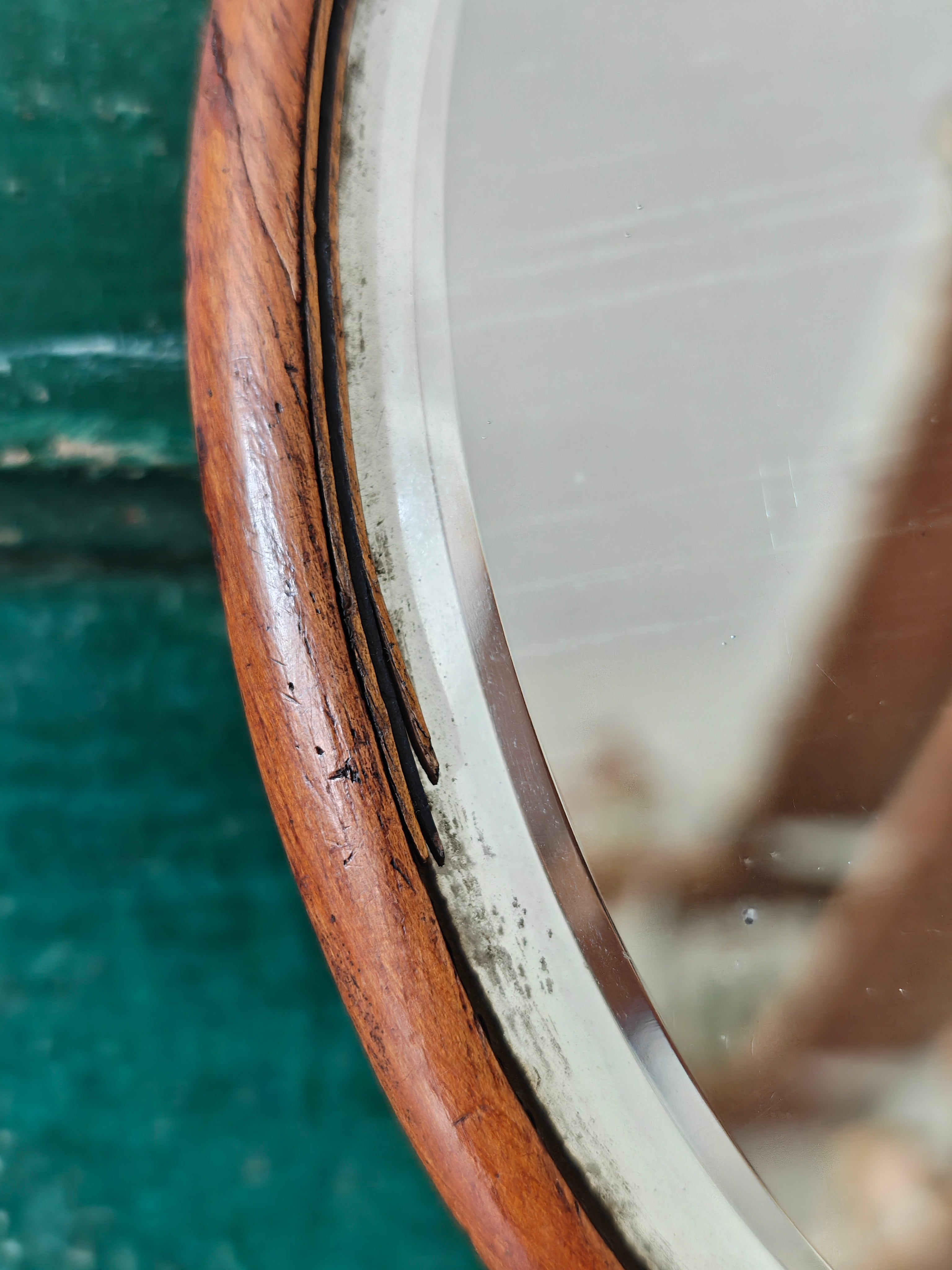 Cles-up of an antique wooden oval hand mirror 
