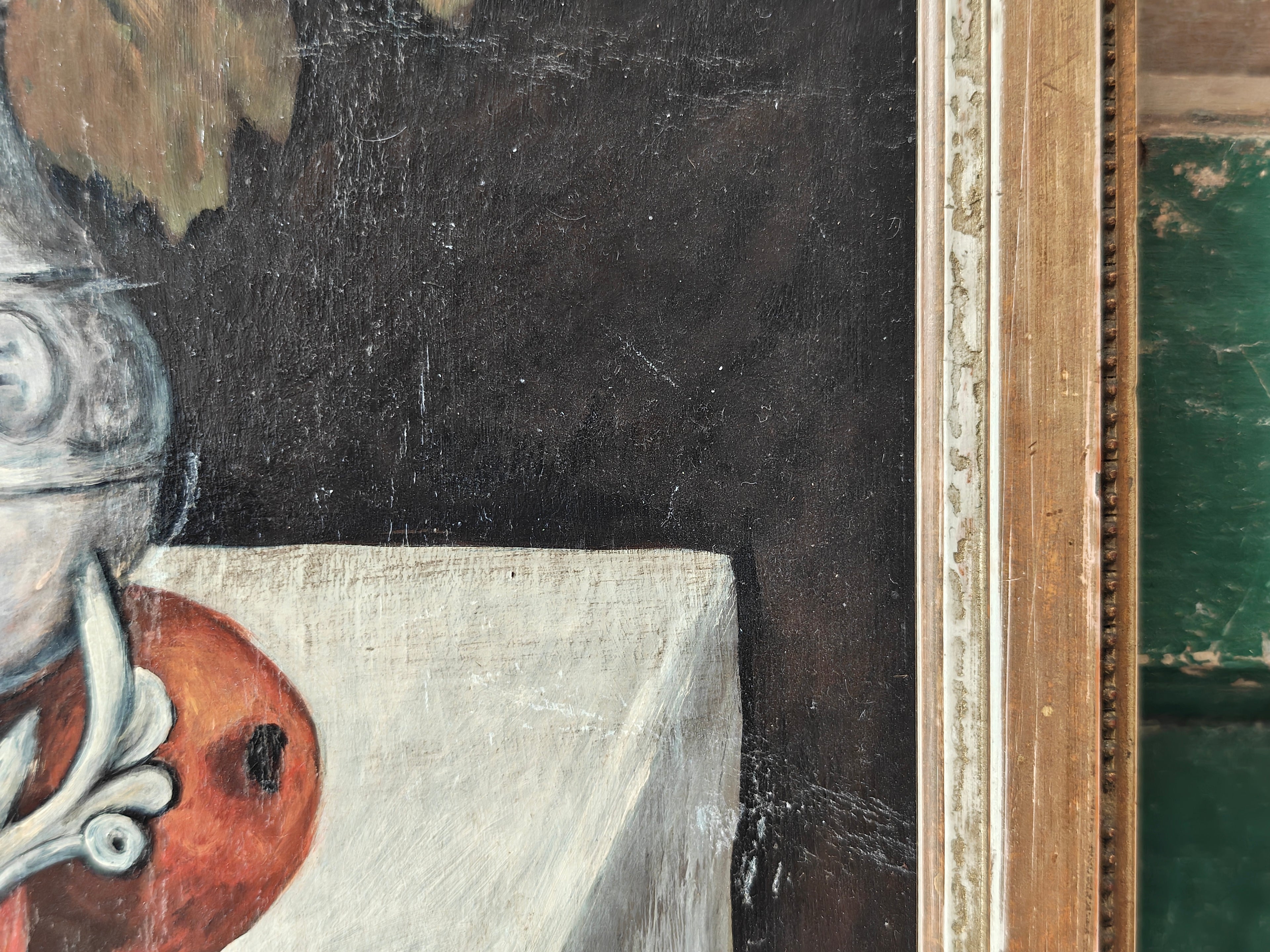 Close-up of a painting showing an object on a table