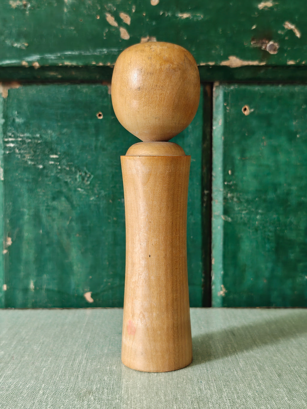 Vintage wooden kokeshi doll back view
