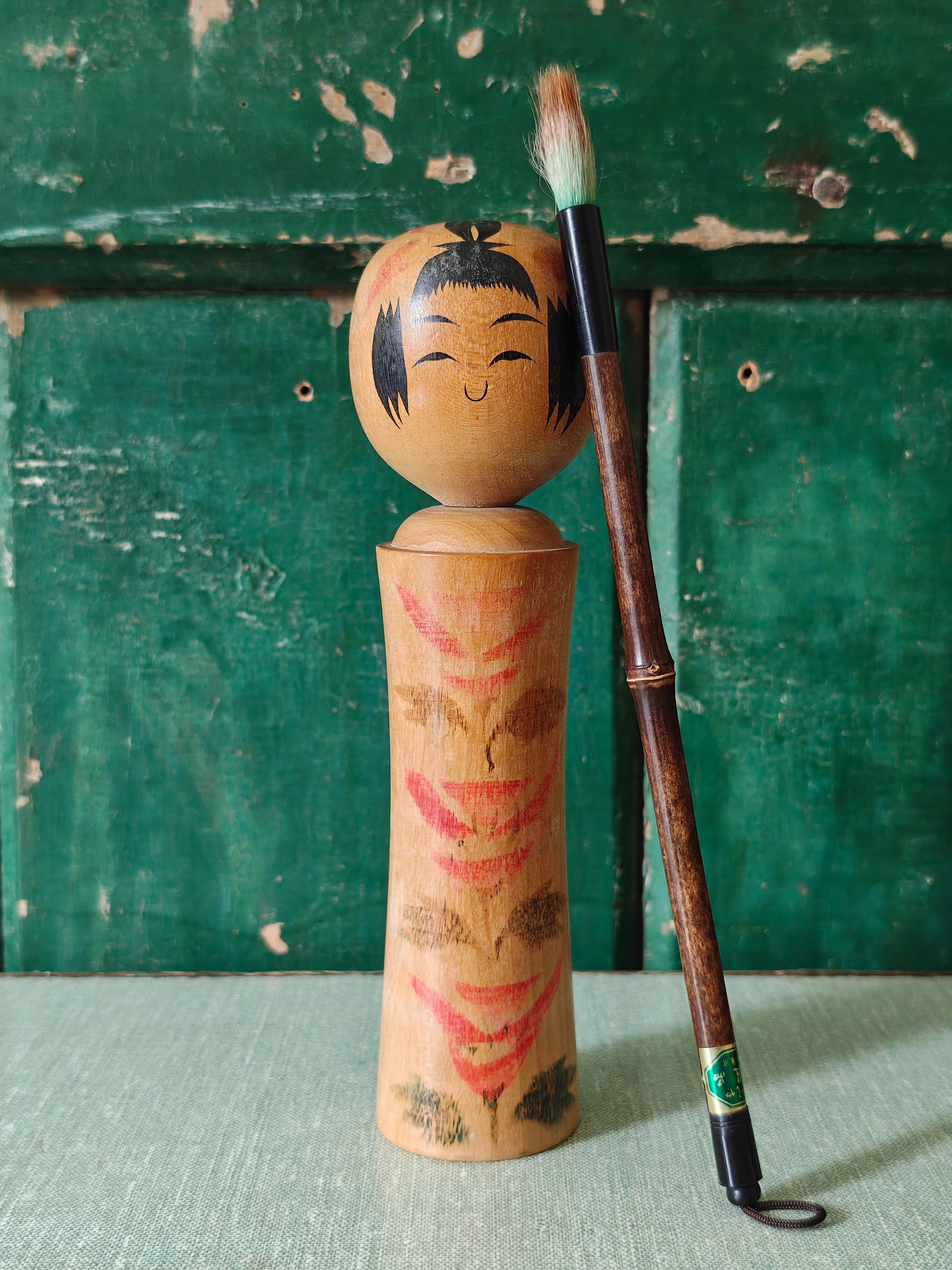 Vintage wooden kokeshi doll with traditional design