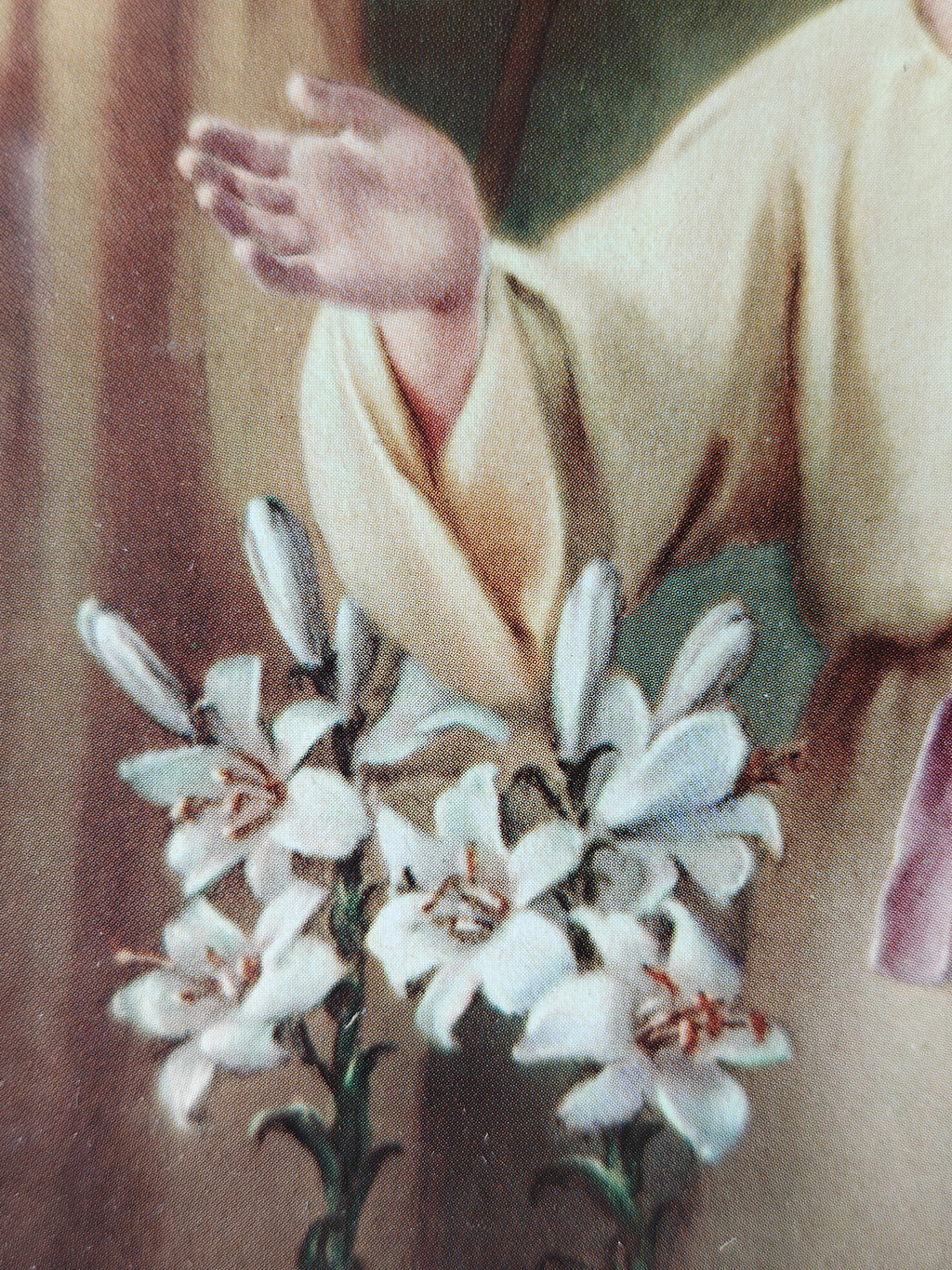 Detail of a colour print of the Holy Family