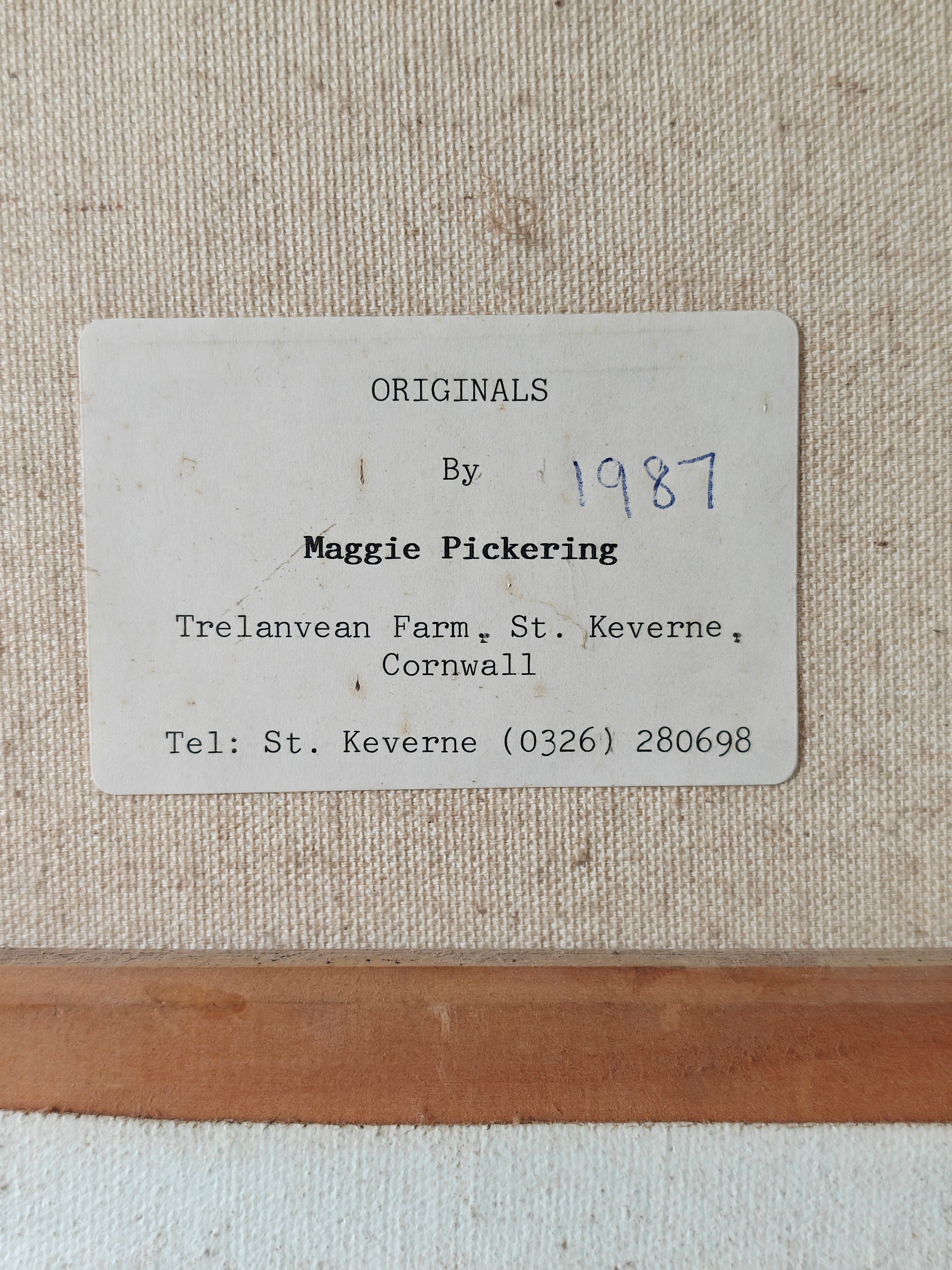 Label showing artist's details on the back of a canvas