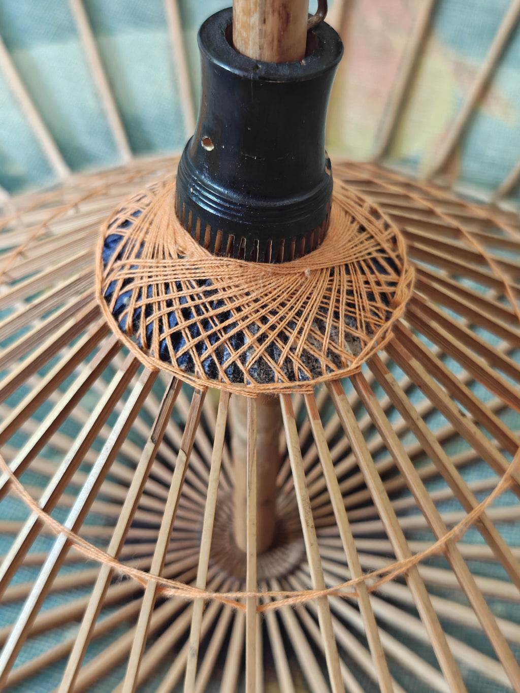 Close-up of the underside of a parasol showing wooden structure