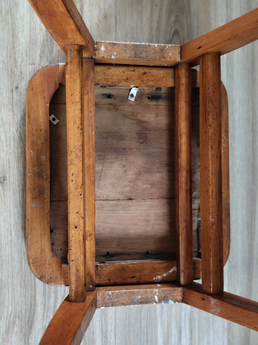 Underside of a wooden stool 