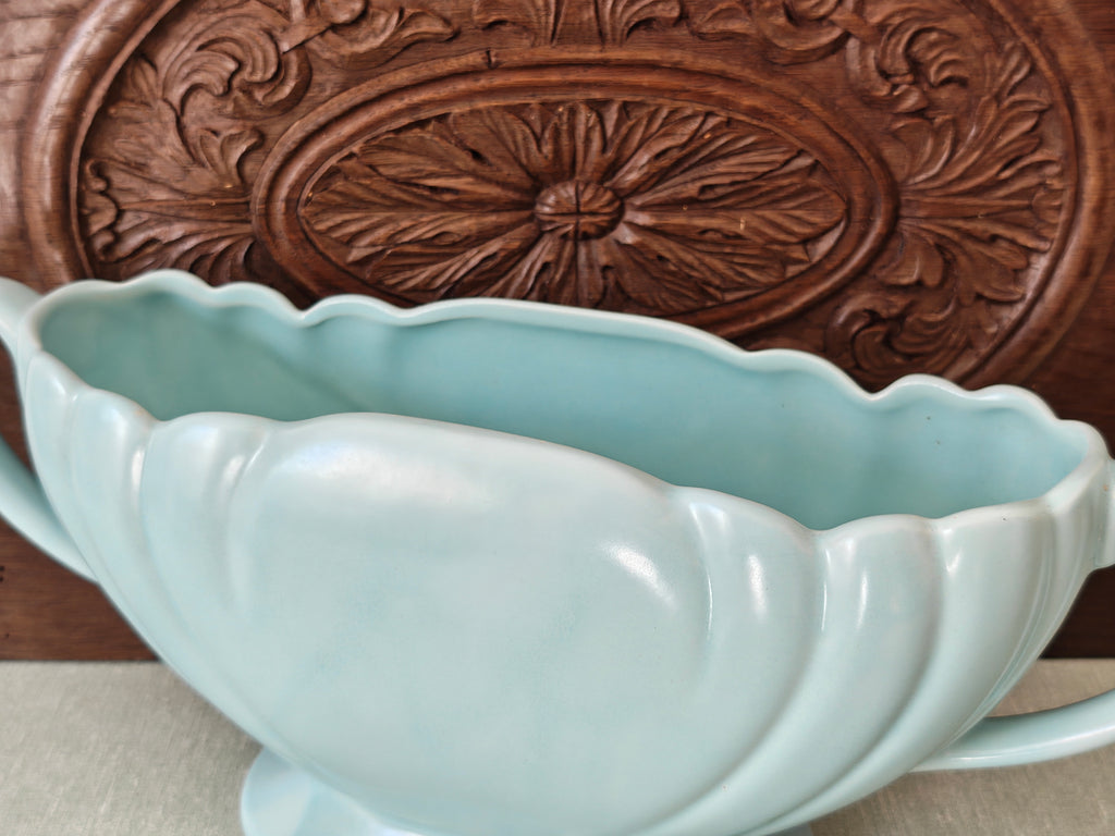 Tope view of a large pale blue mantle vase with fluted form and two handles