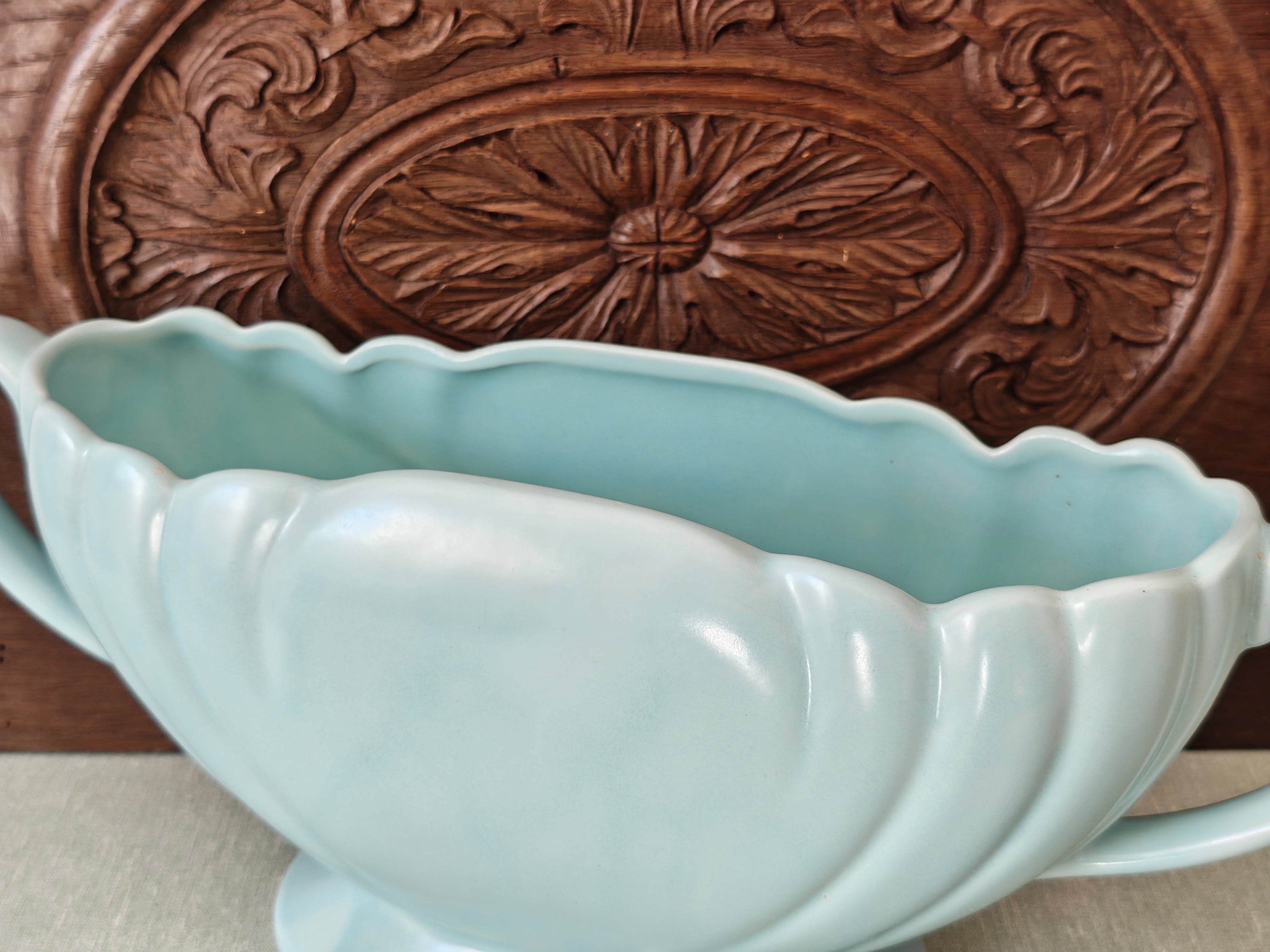 Tope view of a large pale blue mantle vase with fluted form and two handles