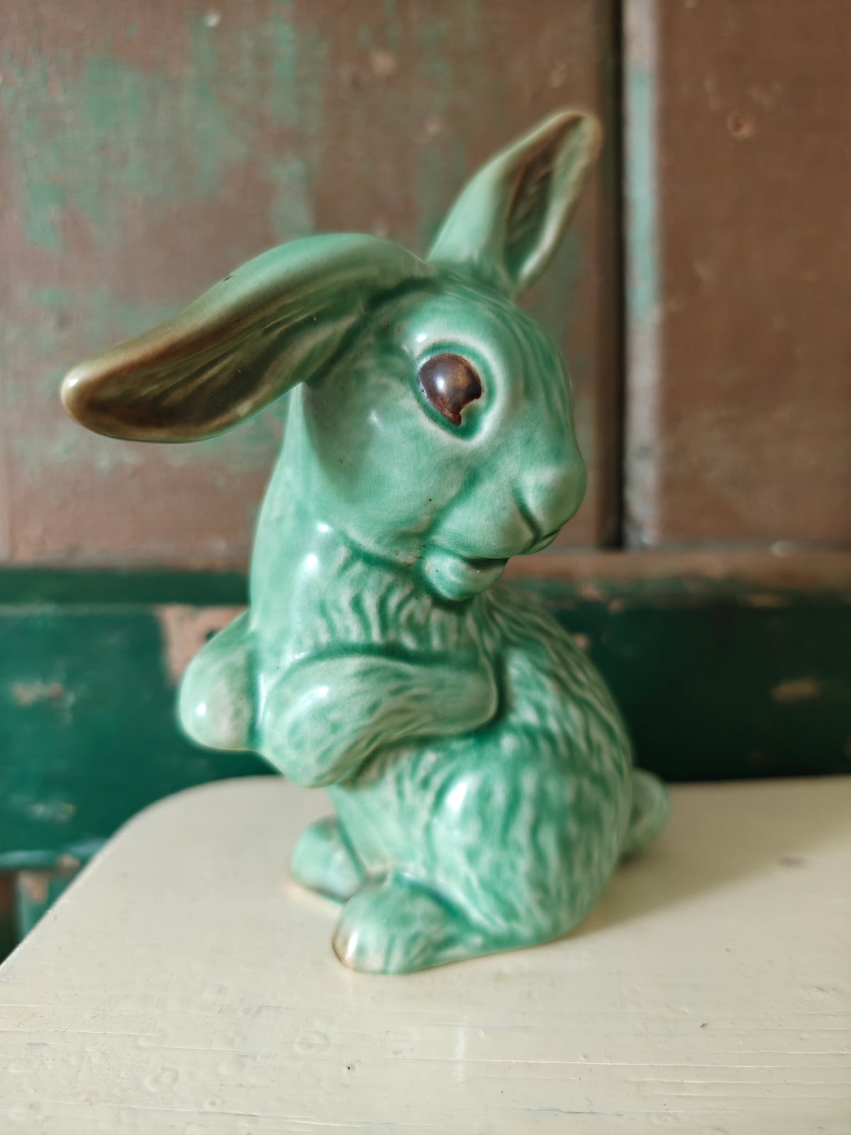 A green glazed ceramic rabbit figurine