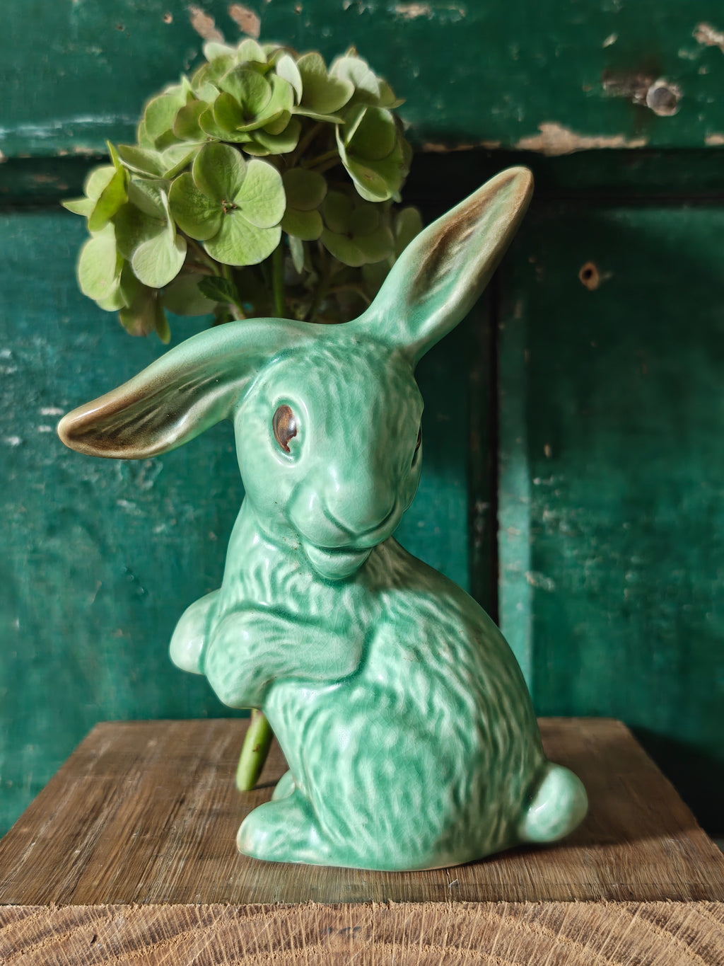 A green glazed ceramic rabbit figurine