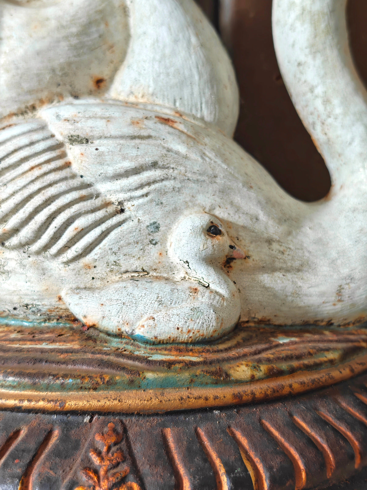 Close up of a swan cygnet as part of a cast iron doorstop