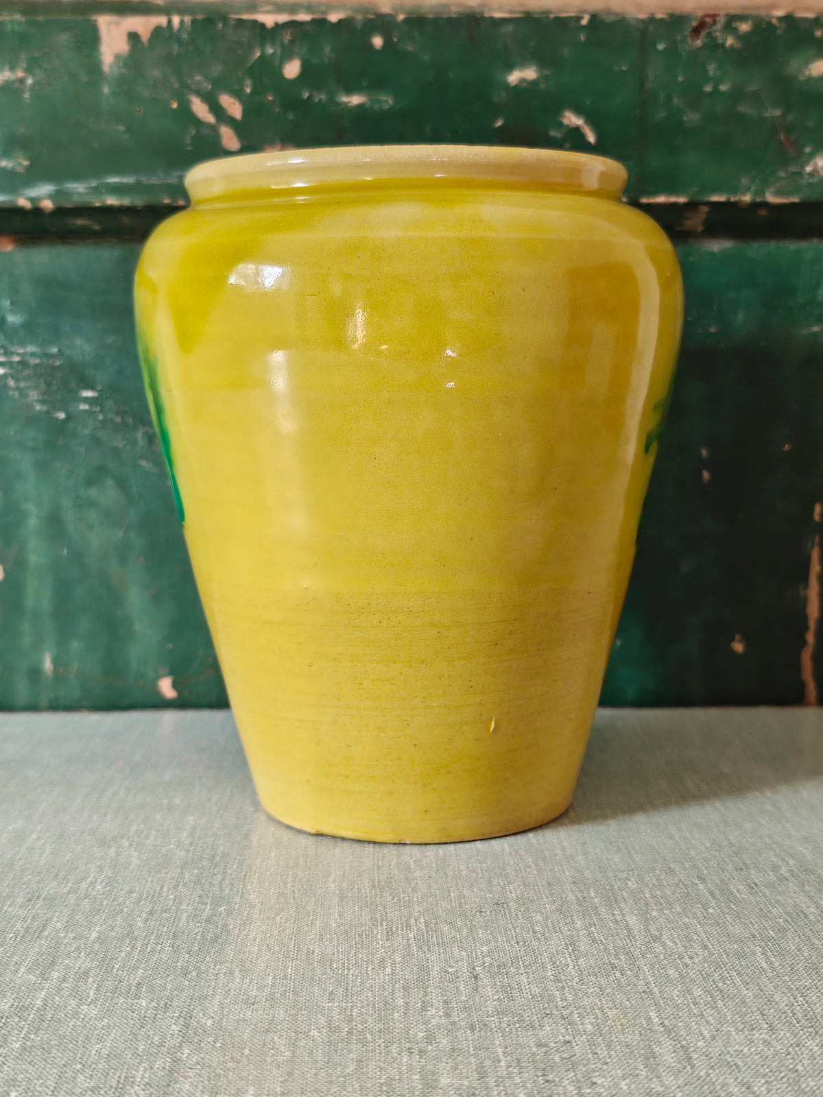 A yellow glazed ceramic jar