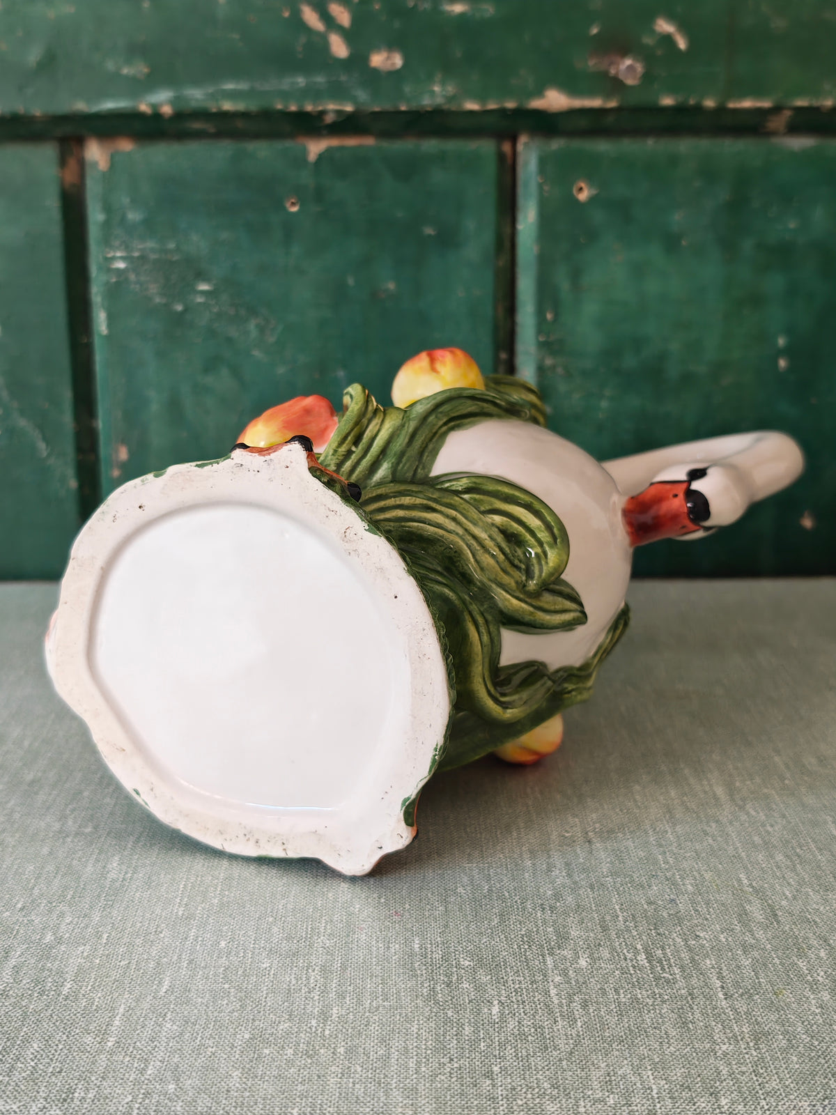 View of the base of a ceramic swan pitcher
