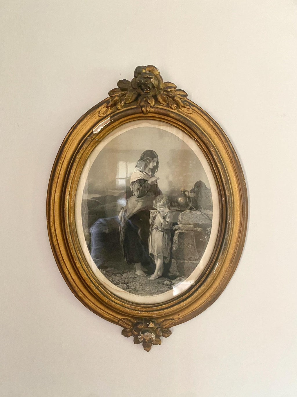 Antique oval portrait  of a woman and child in a gold frame
