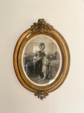 Antique oval portrait  of a woman and child in a gold frame
