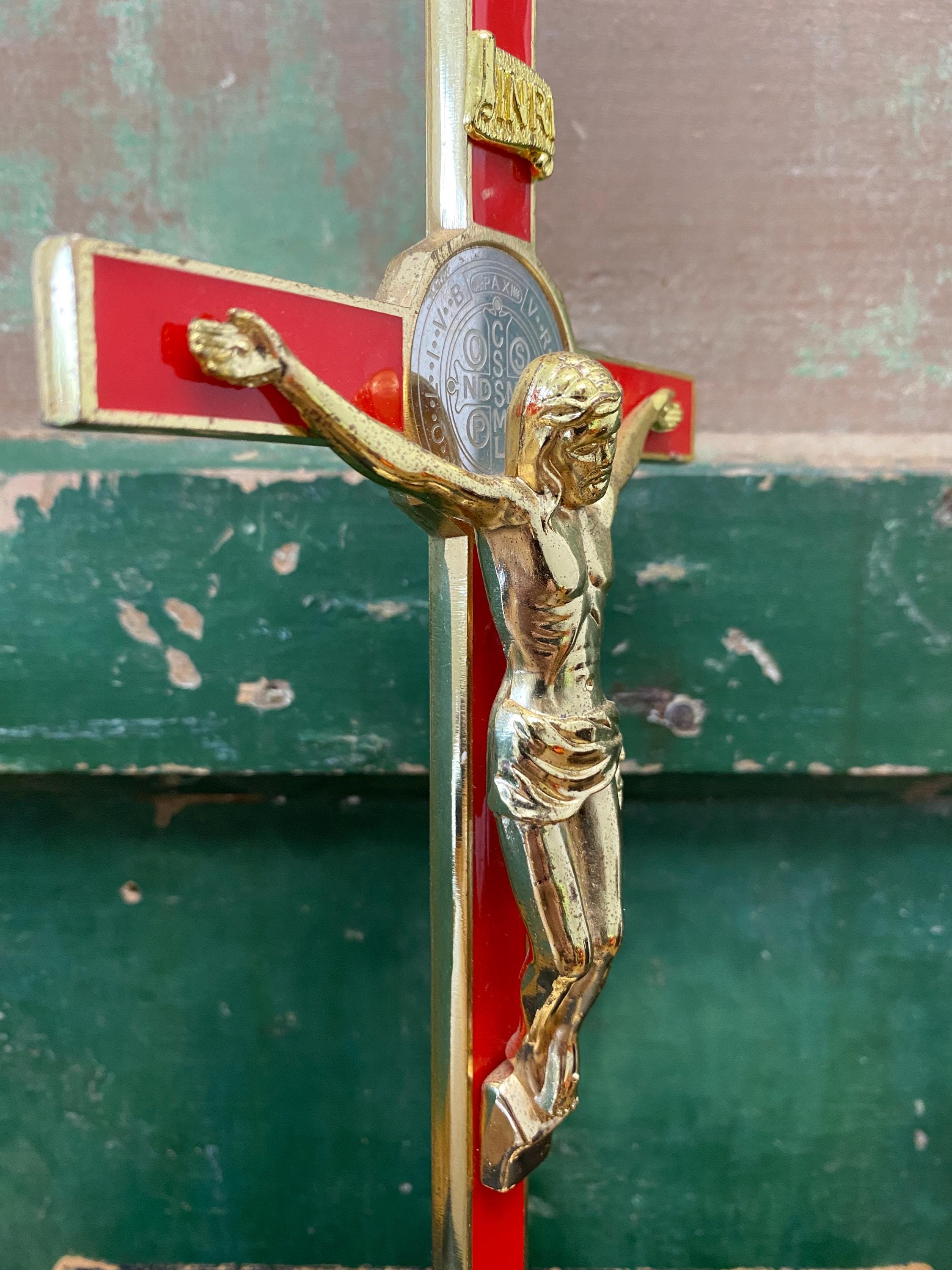 Gold and red decorative crucifix with inset silver medallion