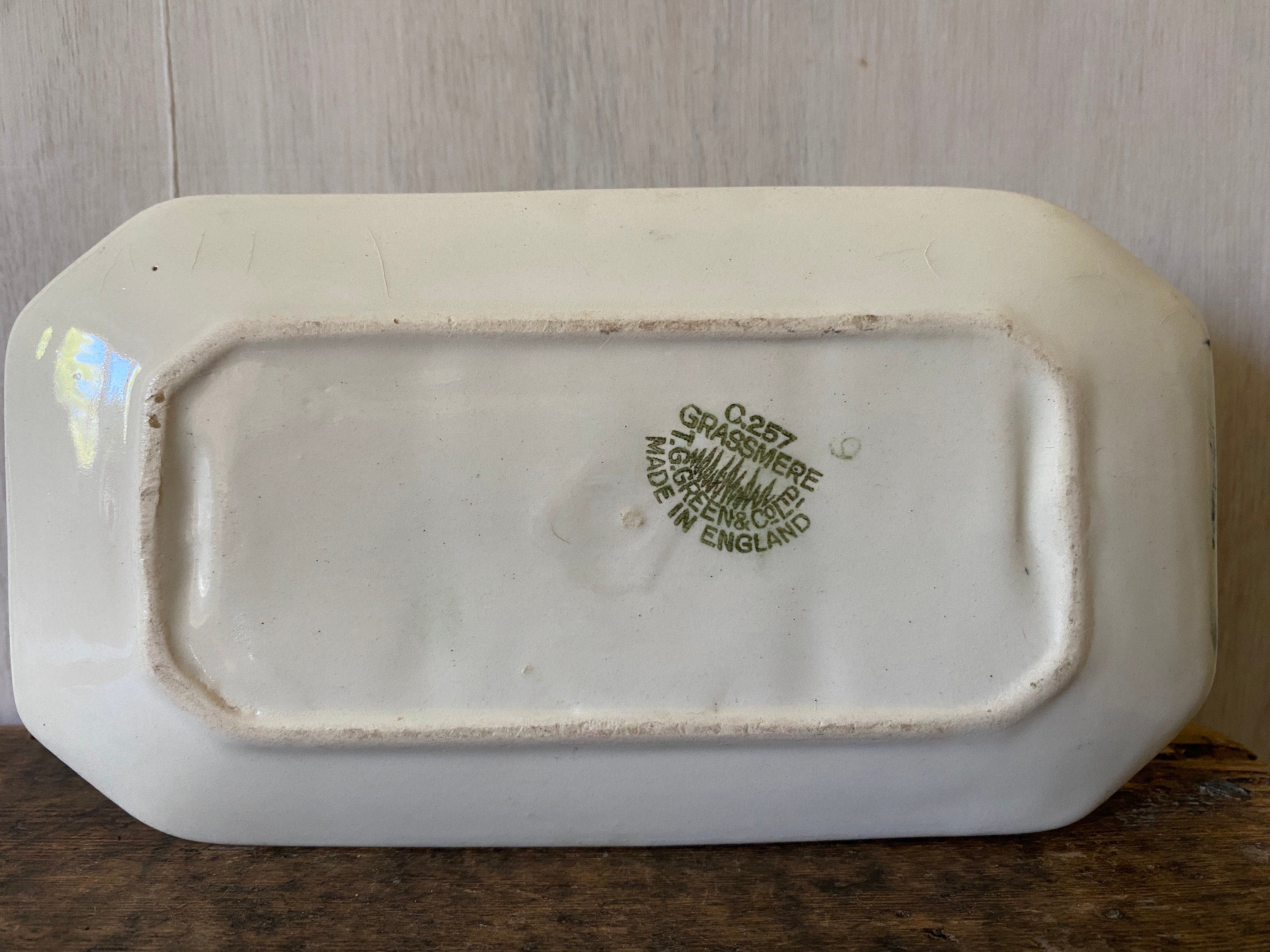 base of a ceramic toast rack with 'grassmere T.G.Green & co ltd' stamped