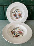 Two floral-patterned ceramic plates 