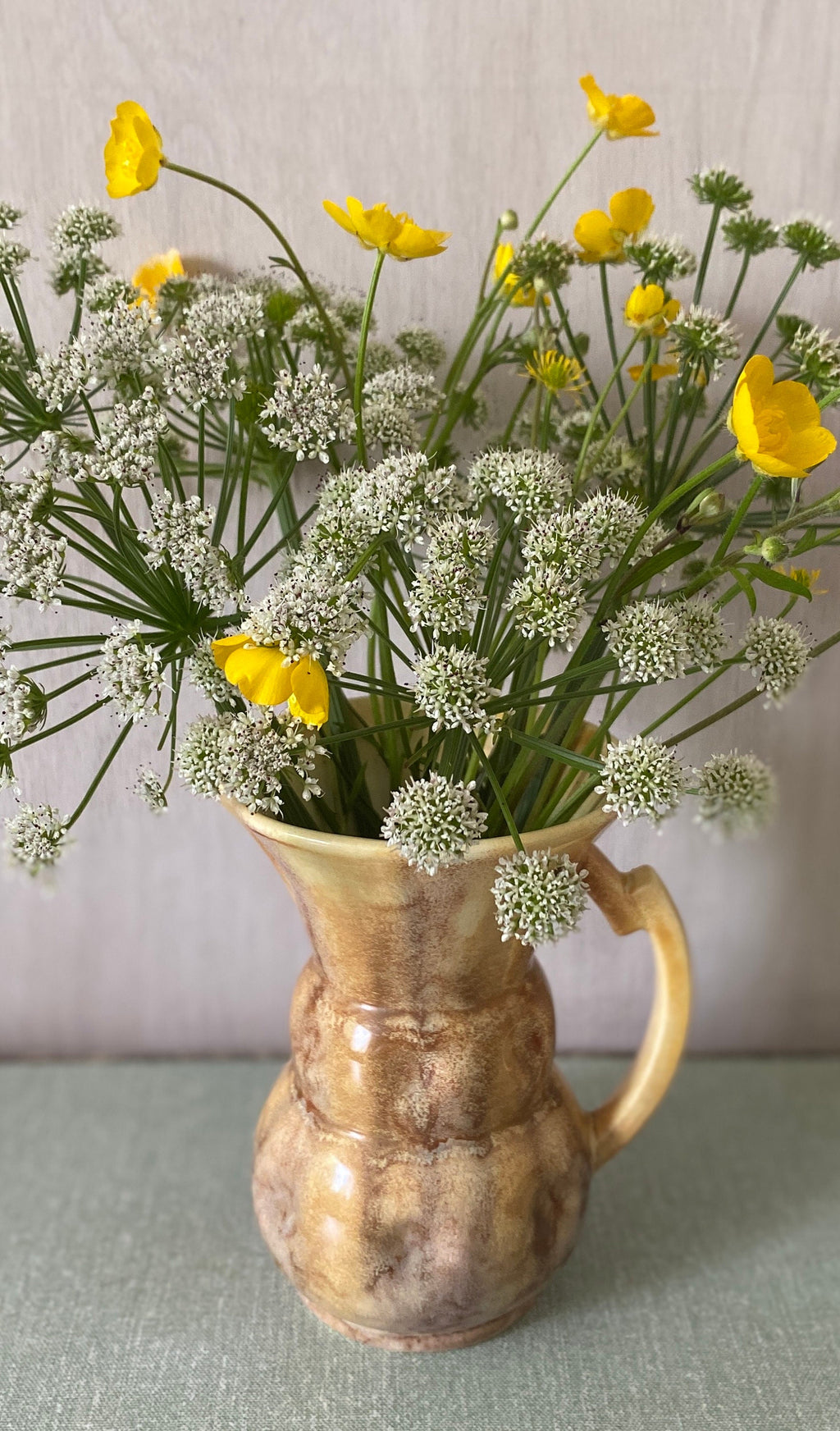 Brown ceramic jug with mottled glaze