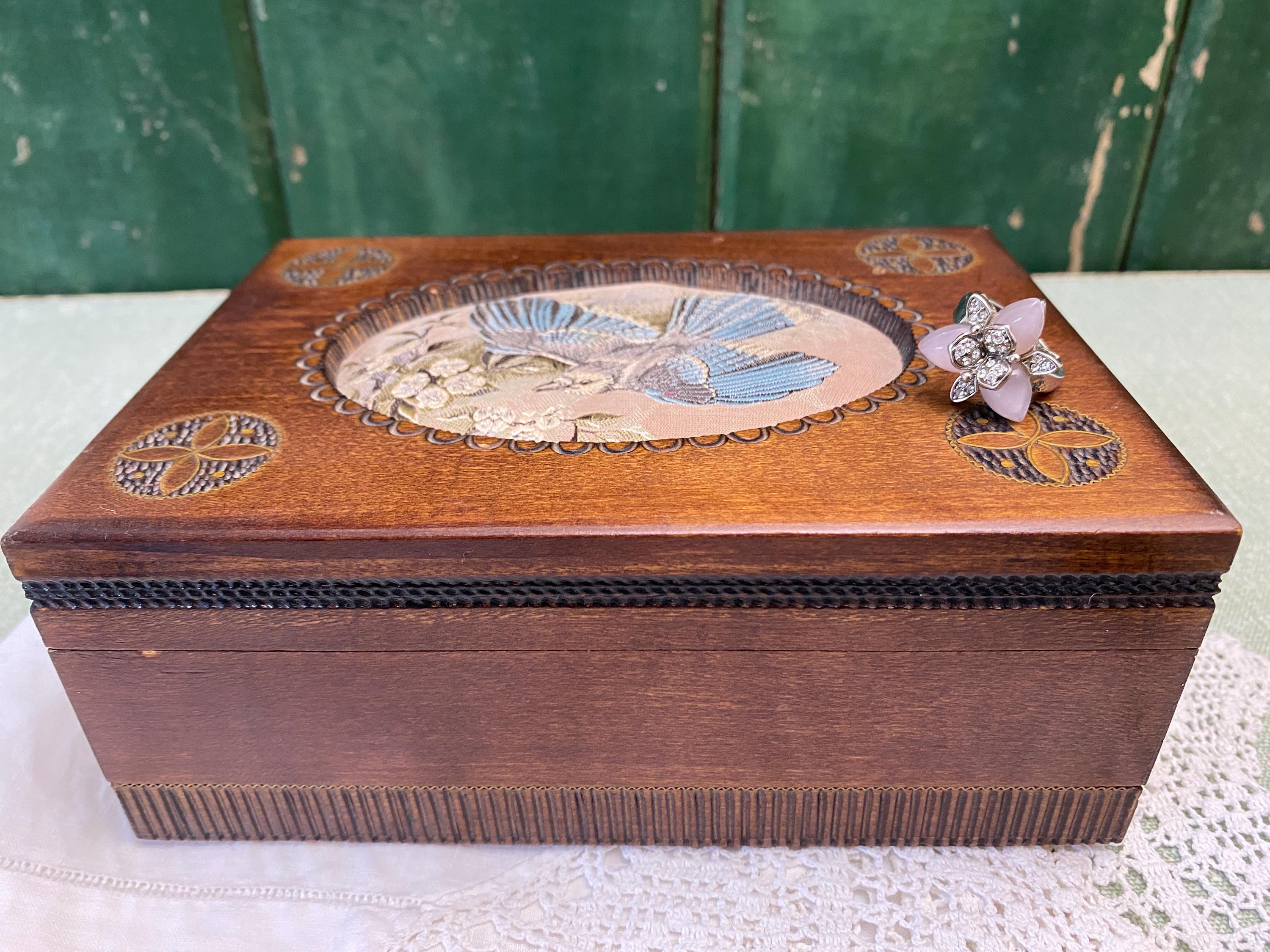 Wooden box with decorative bird design 