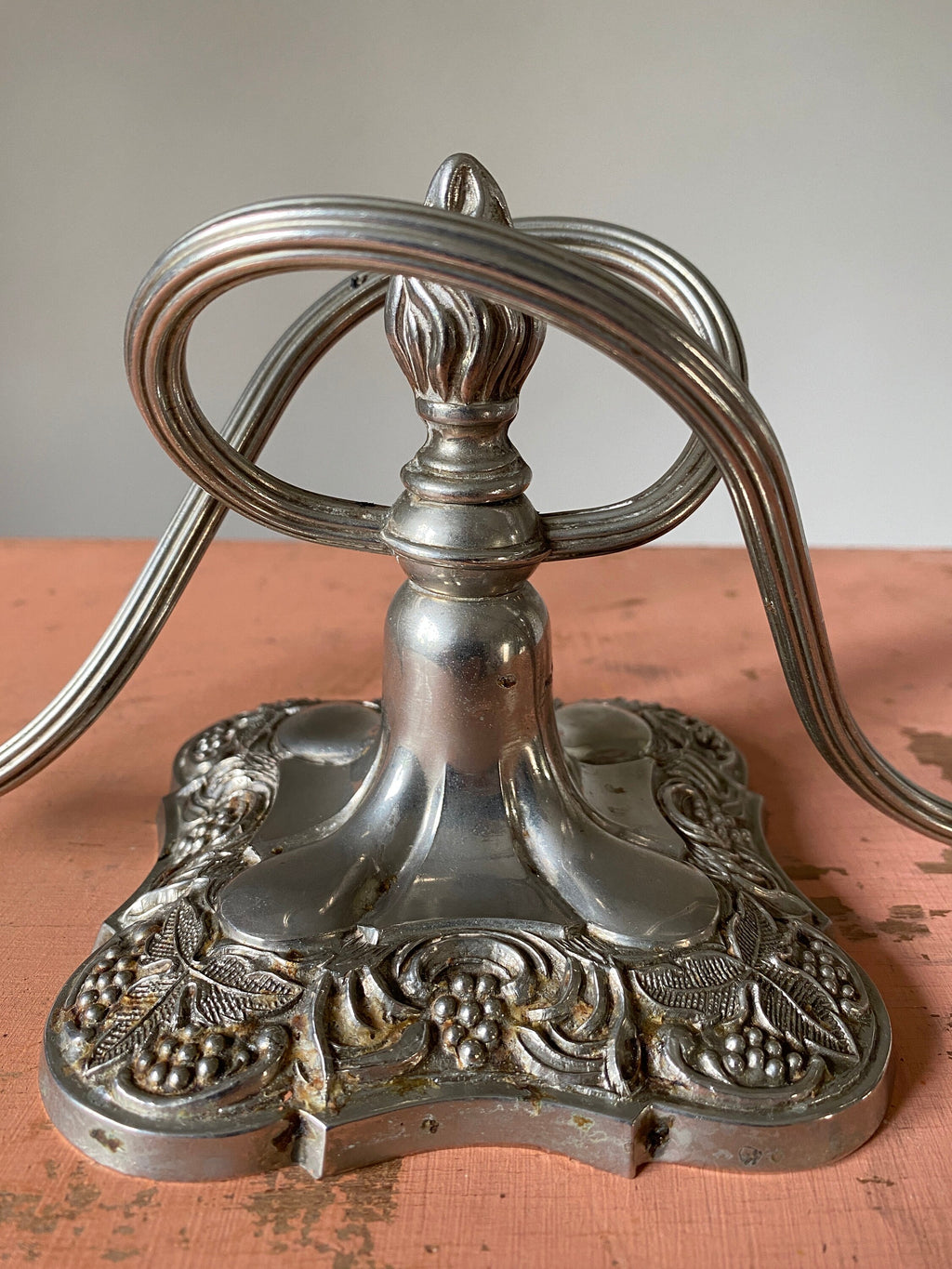 Decorative metal base of a candle holder with intricate designs