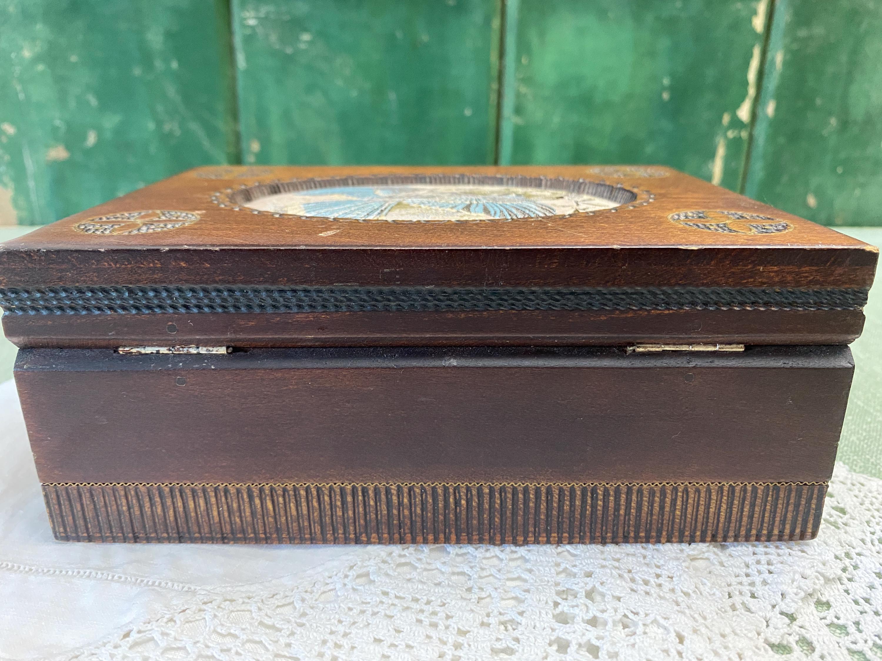 Wooden jewelry box with decorative elements 