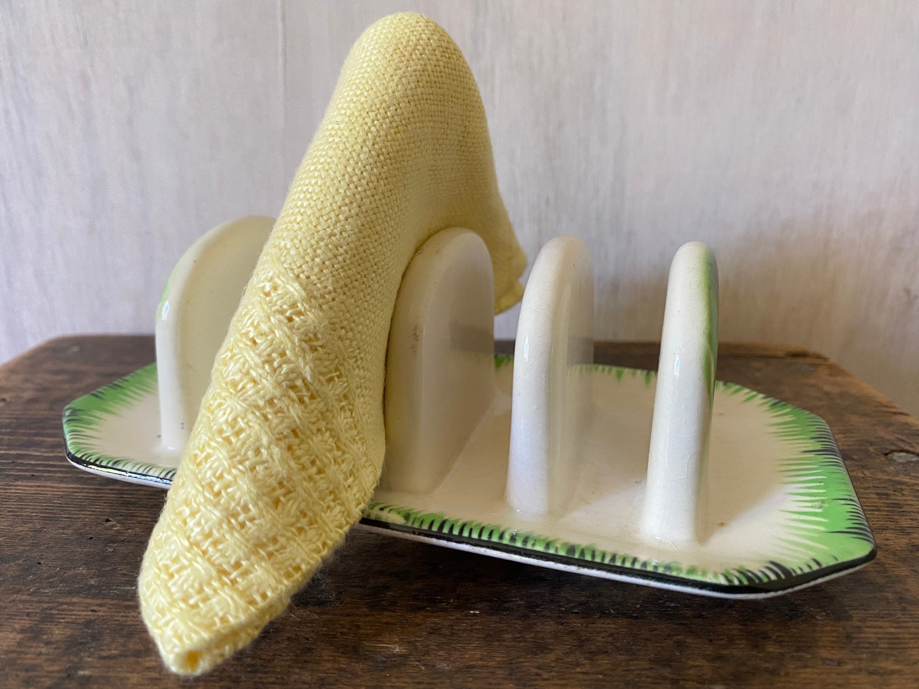 green and white ceramic toast rack