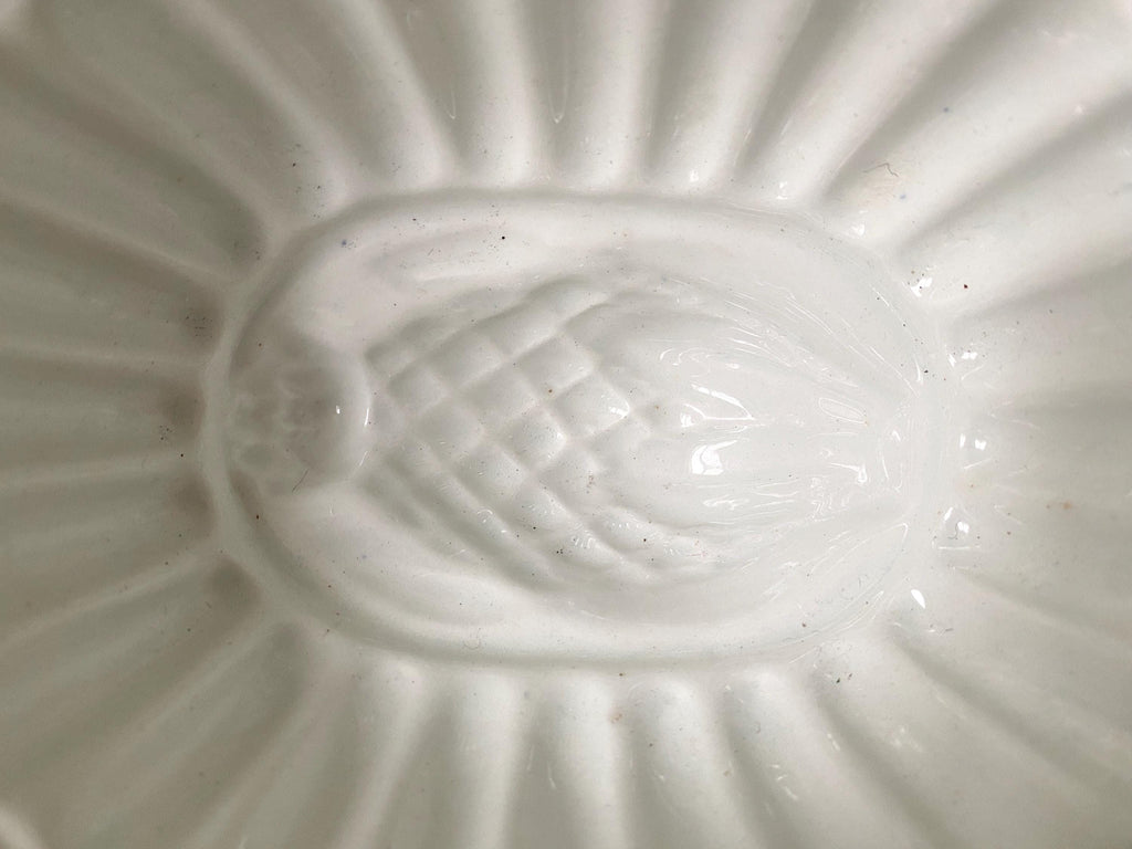 Close-up of a vintage jelly mould thistle design