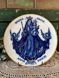 Decorative plate with blue and gold religious design featuring Mary and angels