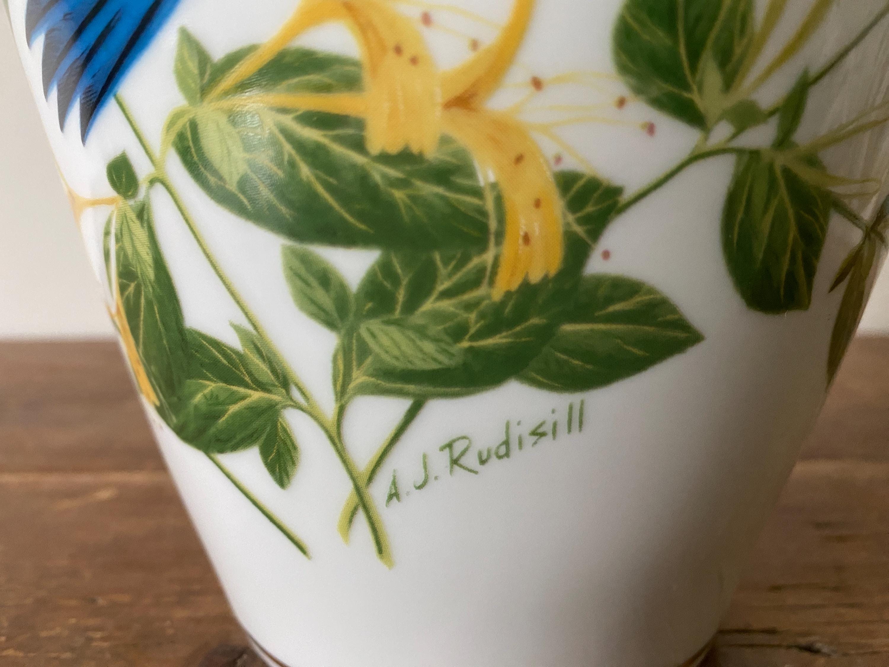 Vase with floral design and 'A.J. Rudisill' branding