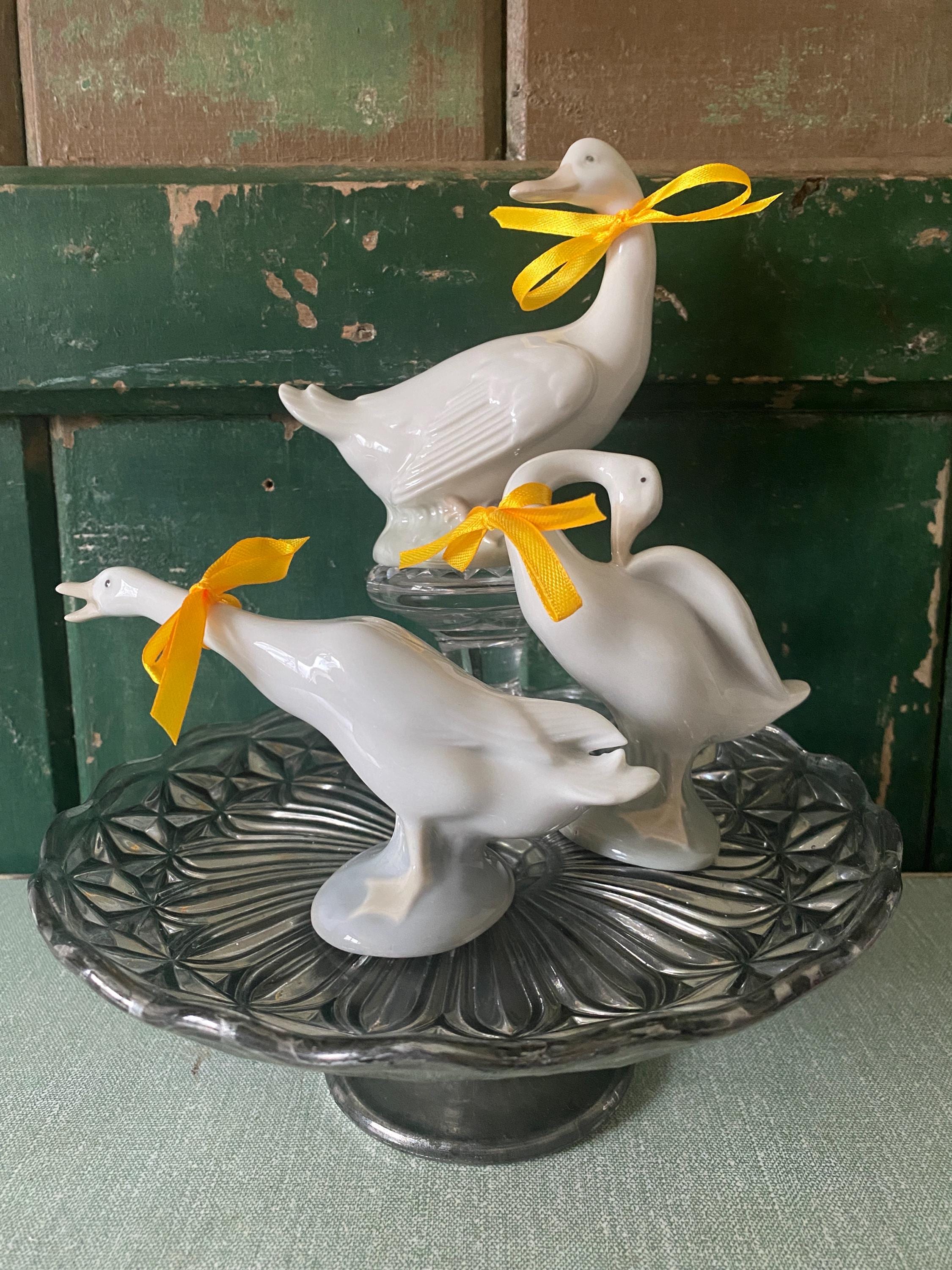 A group of ceramic geese figurines