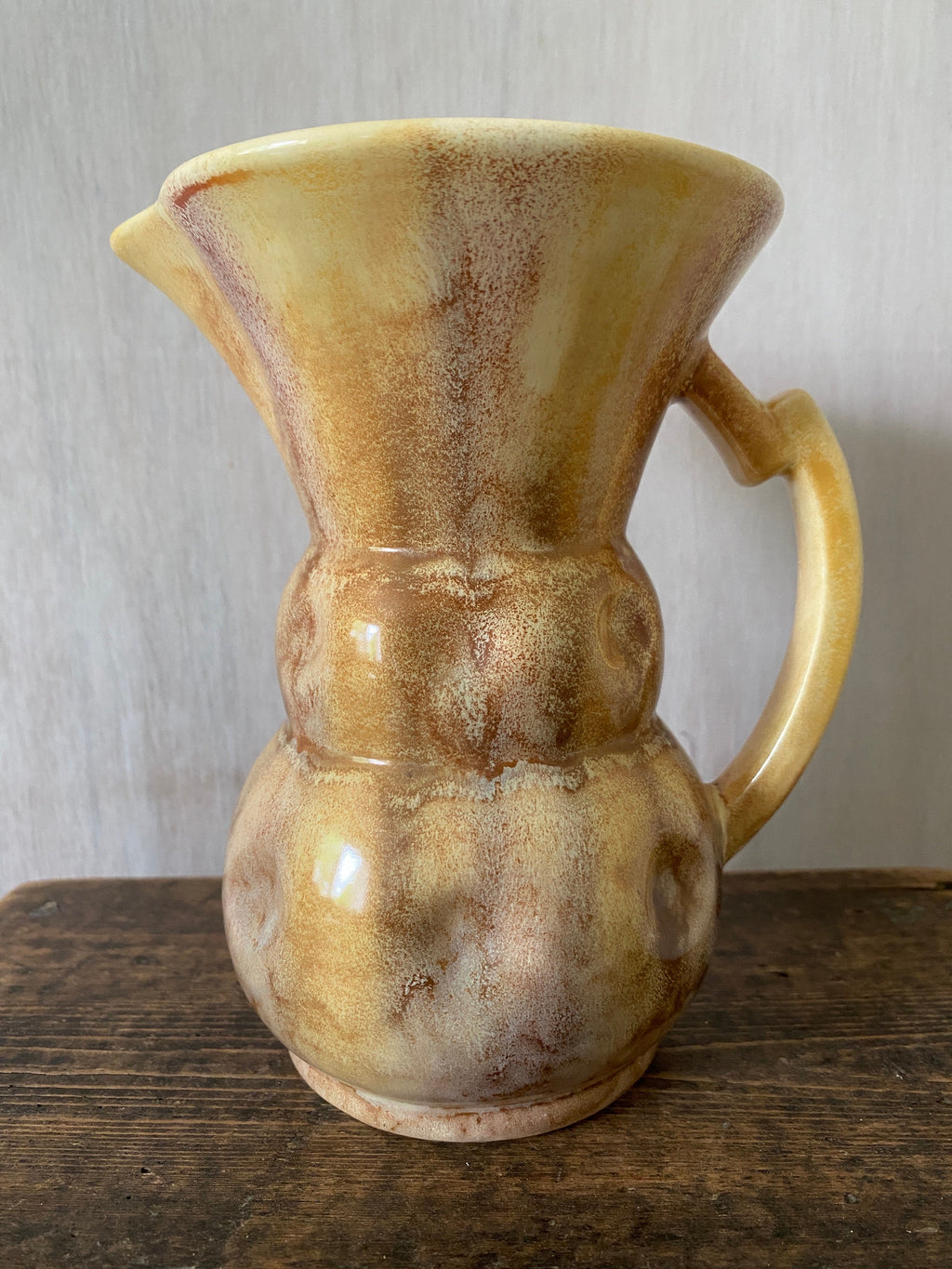 Brown ceramic jug with mottled glaze