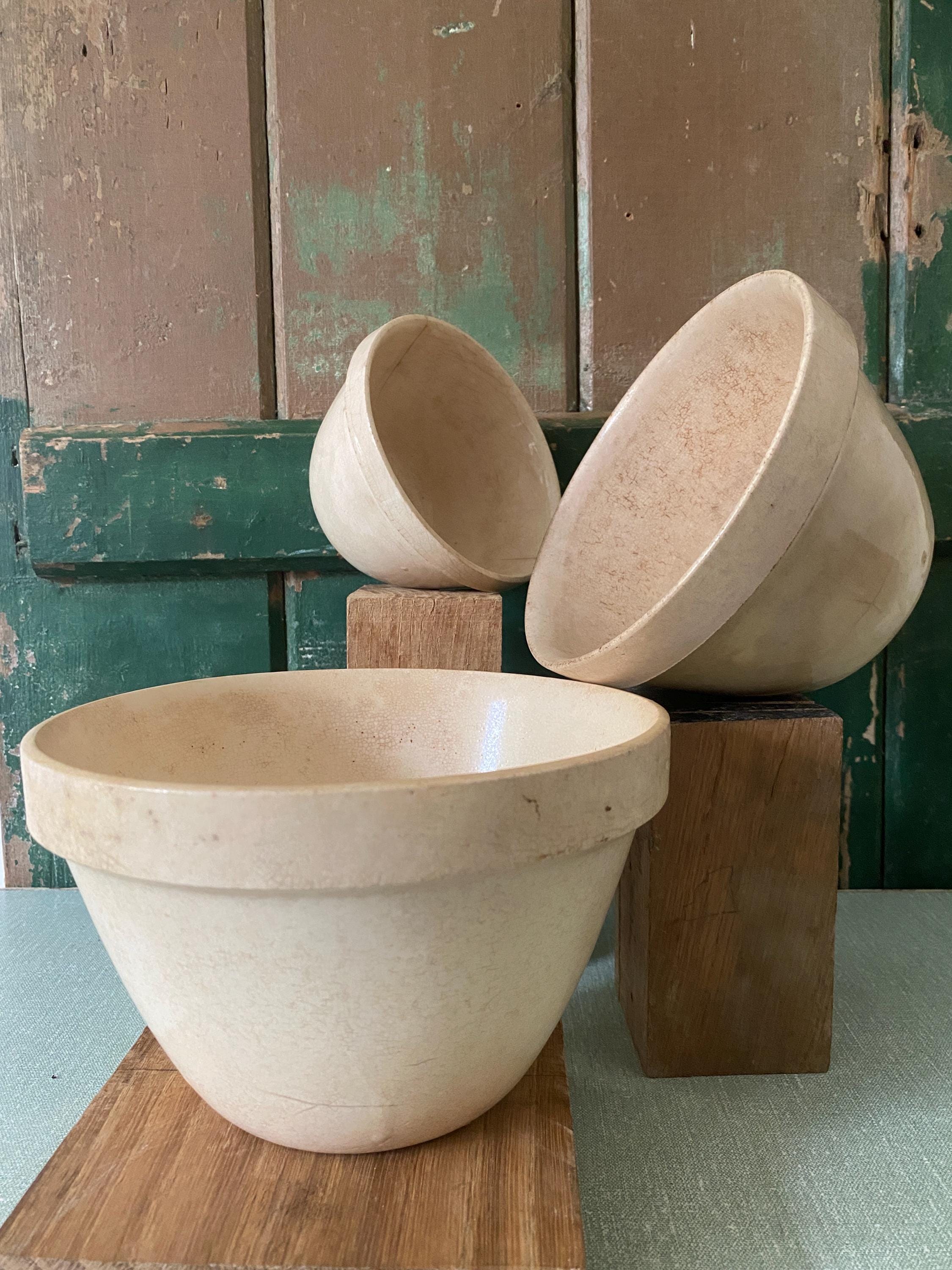 Three ceramic pudding bowls of different sizes 