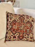 Decorative cushion with intricate woven patterns