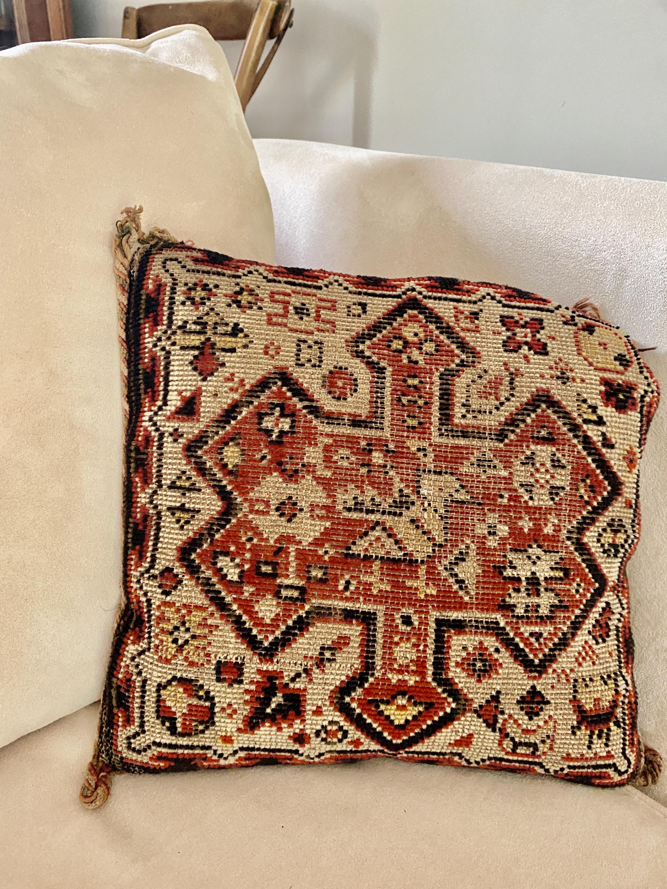 Decorative cushion with intricate woven patterns
