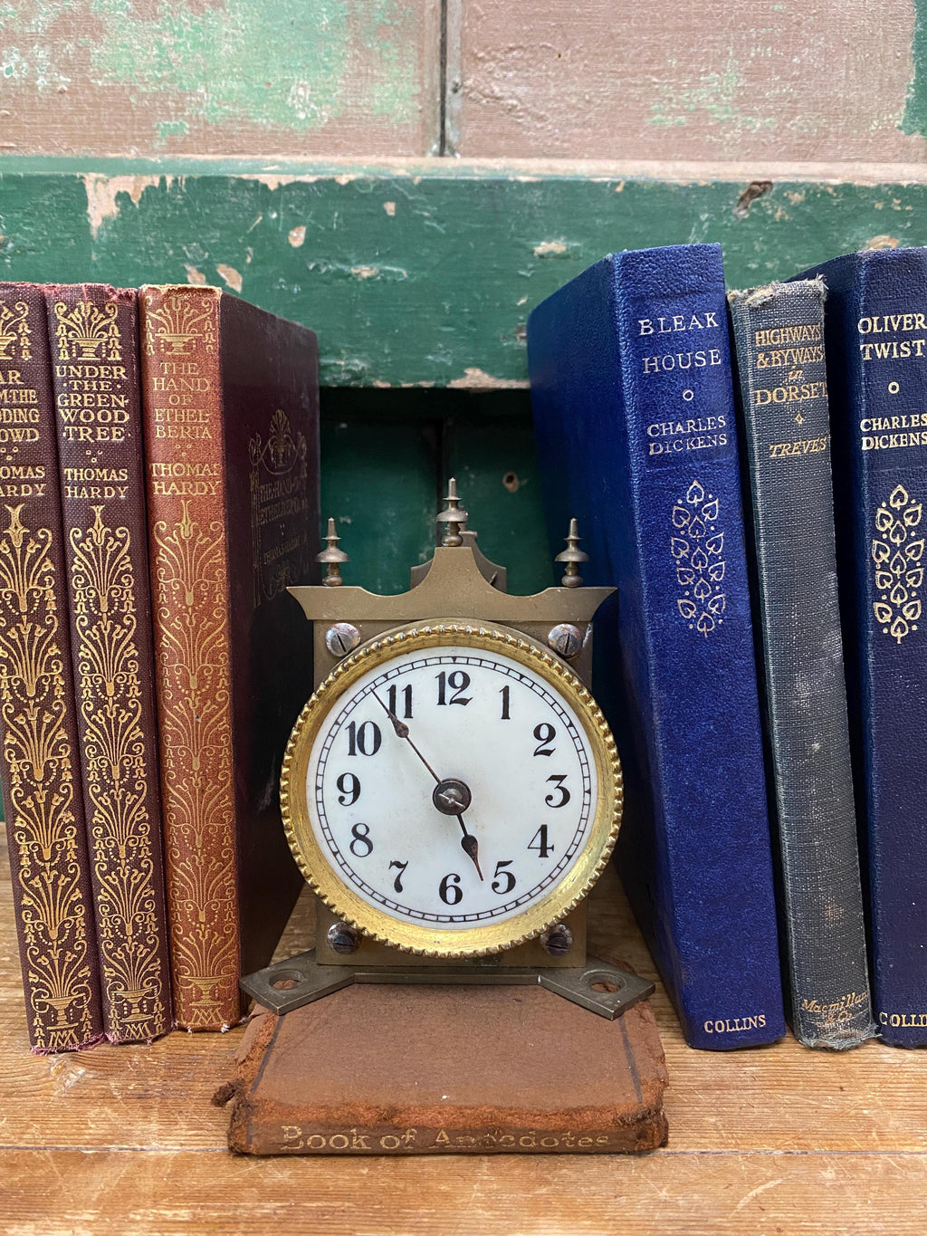 Vintage brass clock movement with white face