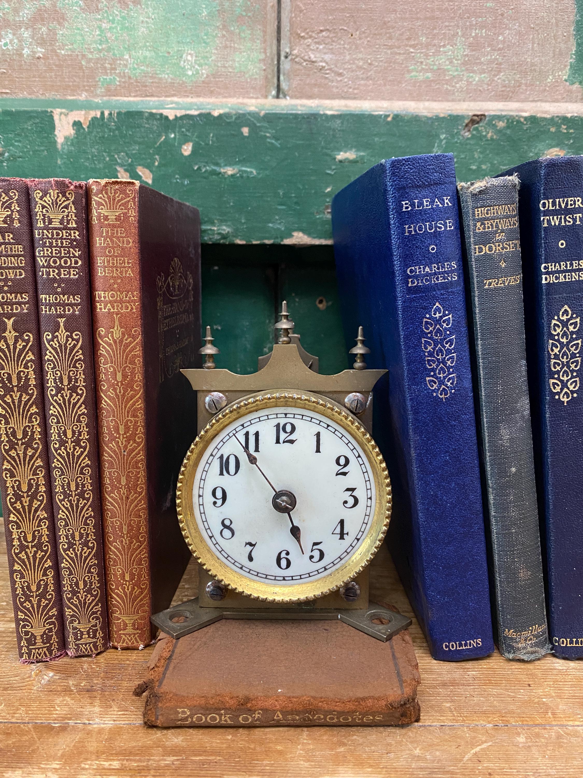 Vintage brass clock movement with white face