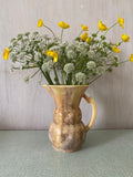 Brown ceramic jug with mottled glaze