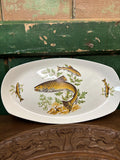 Decorative ceramic platter with fish and seaweed design