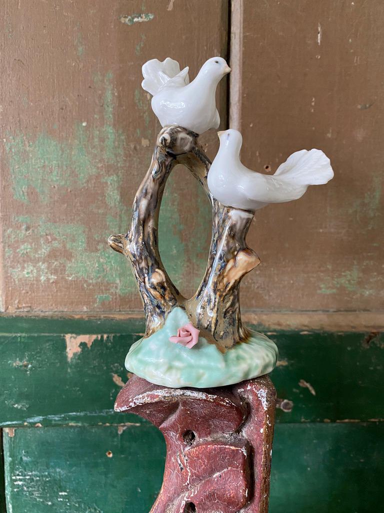 Decorative ceramic sculpture with white birds 