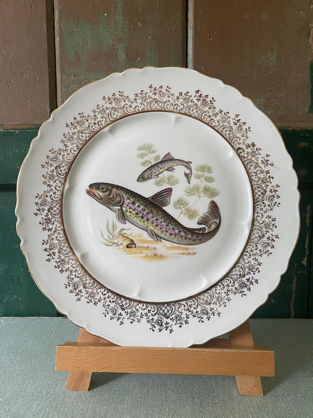 Set of three decorative plates with fish illustrations 