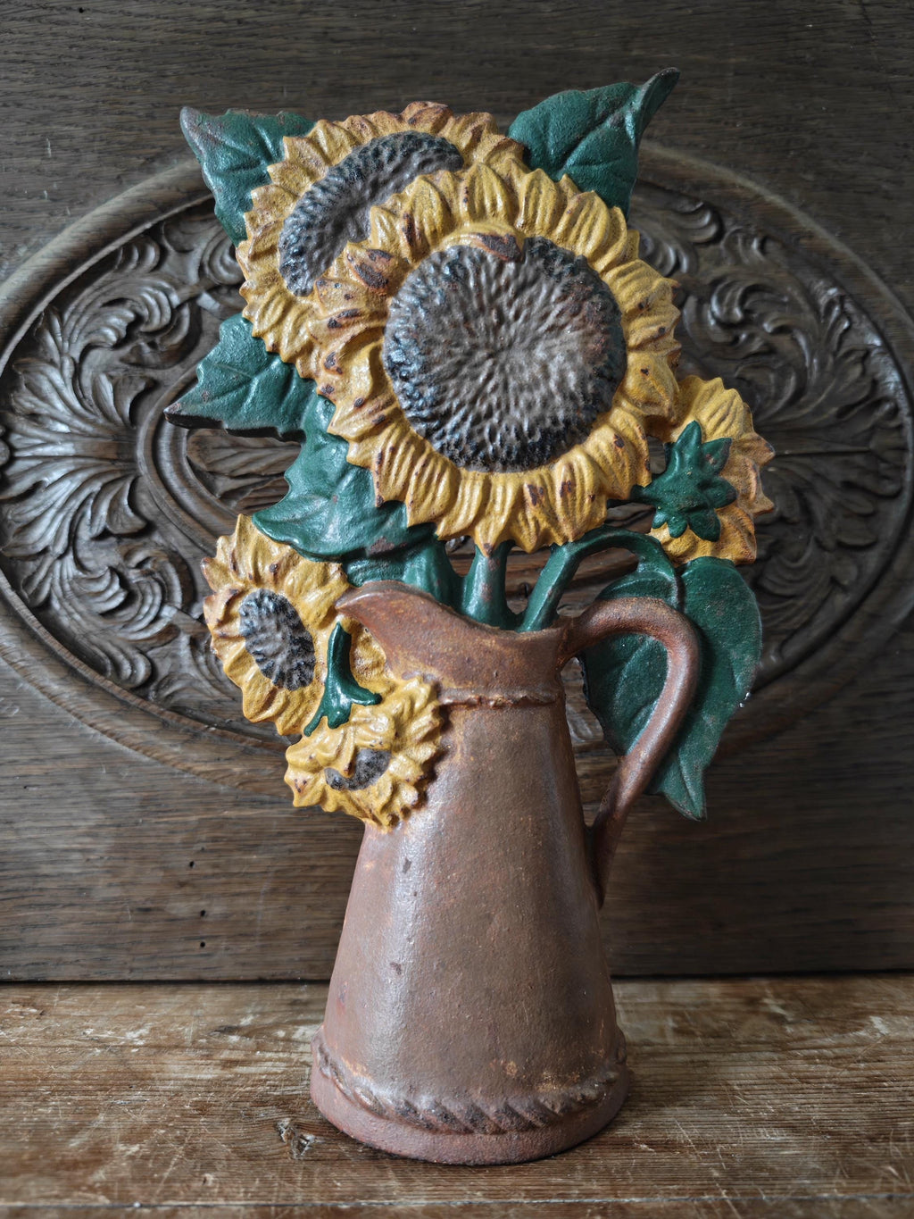 Decorative sunflower sculpture in a brown vase