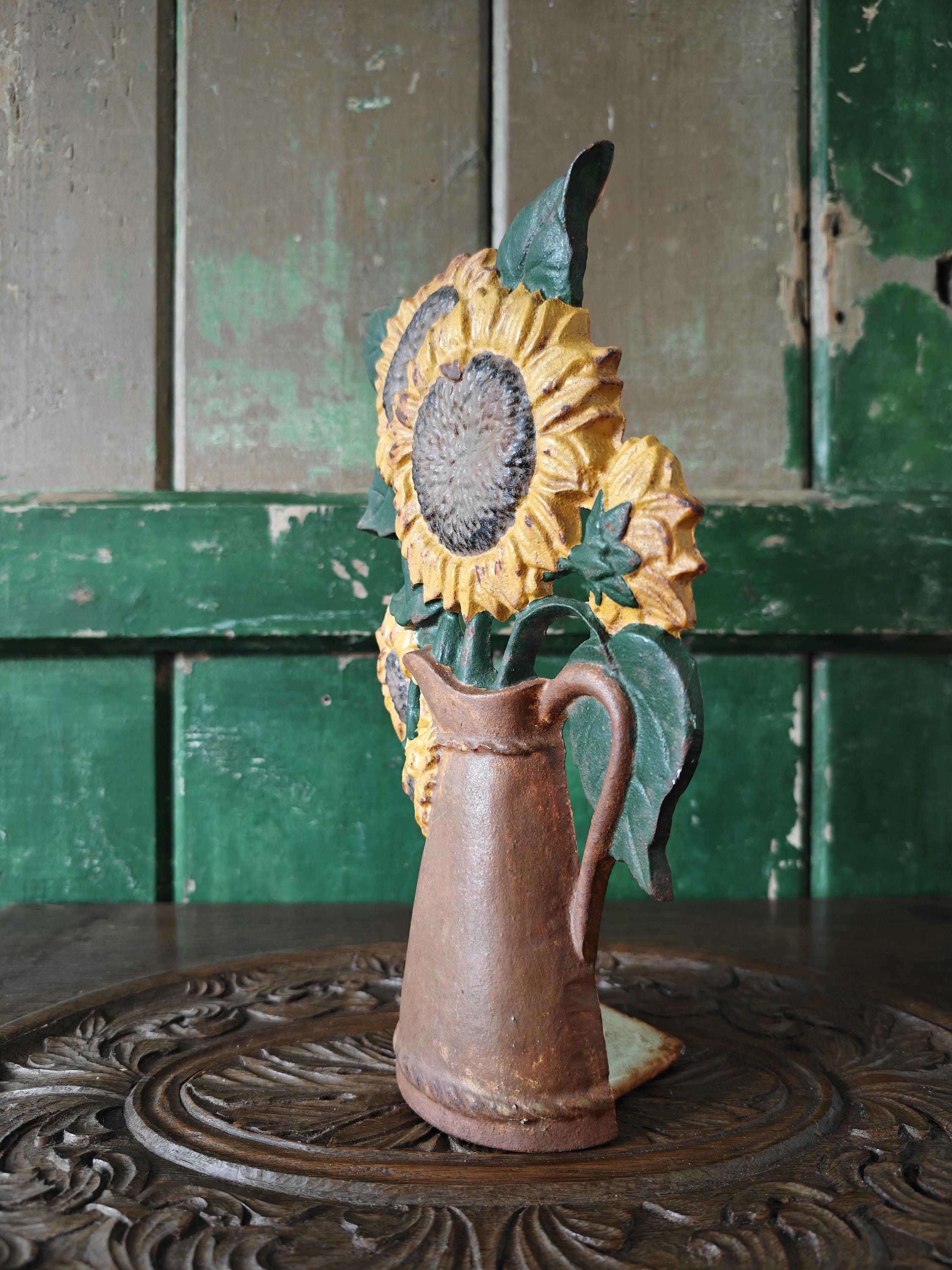 A doorstop depicting sunflowers in a brown jug