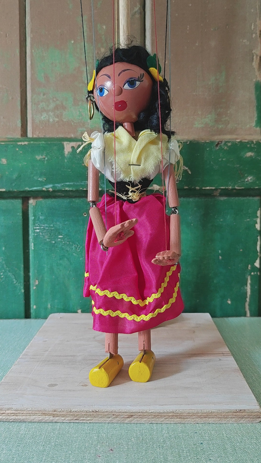 A string puppet moving arms and legs