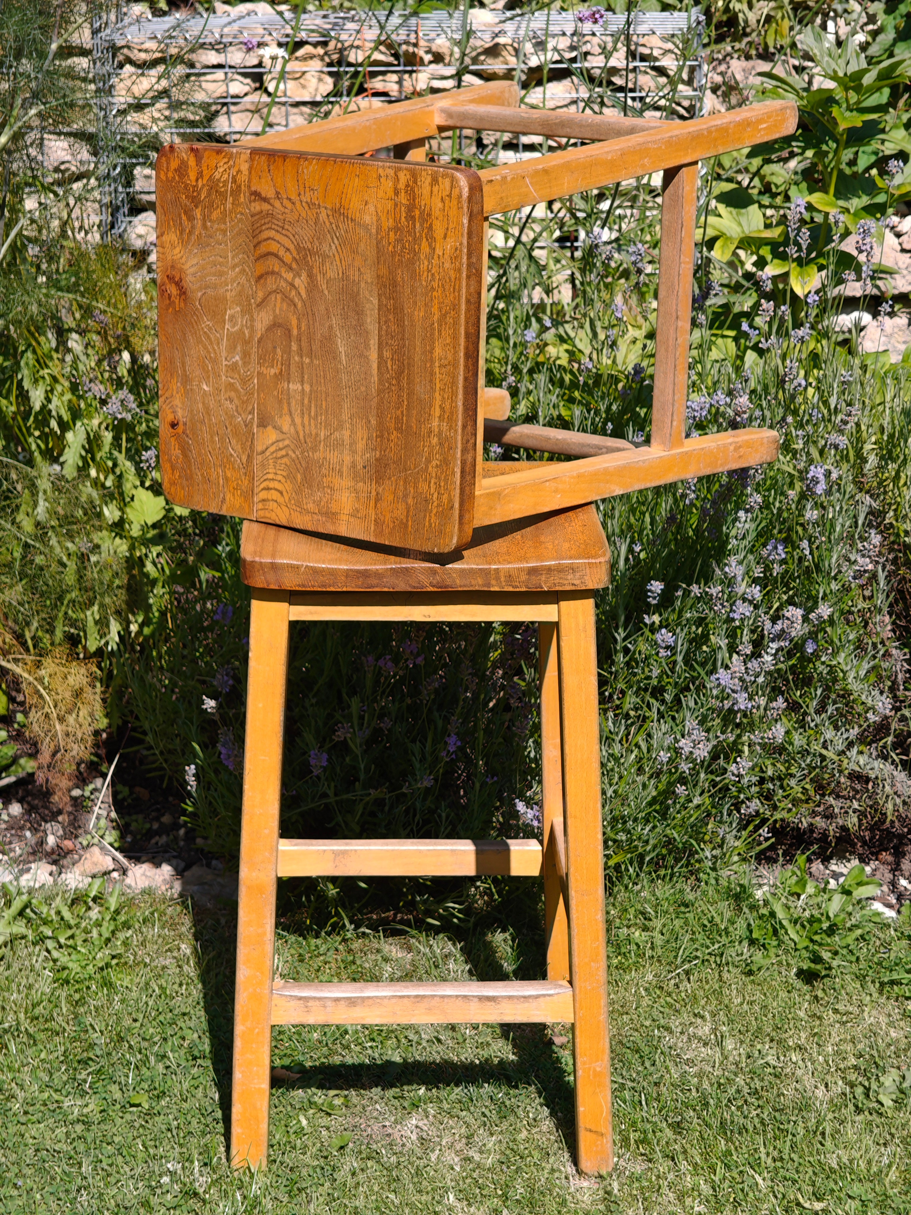 A pair of vintage wooden lab stools