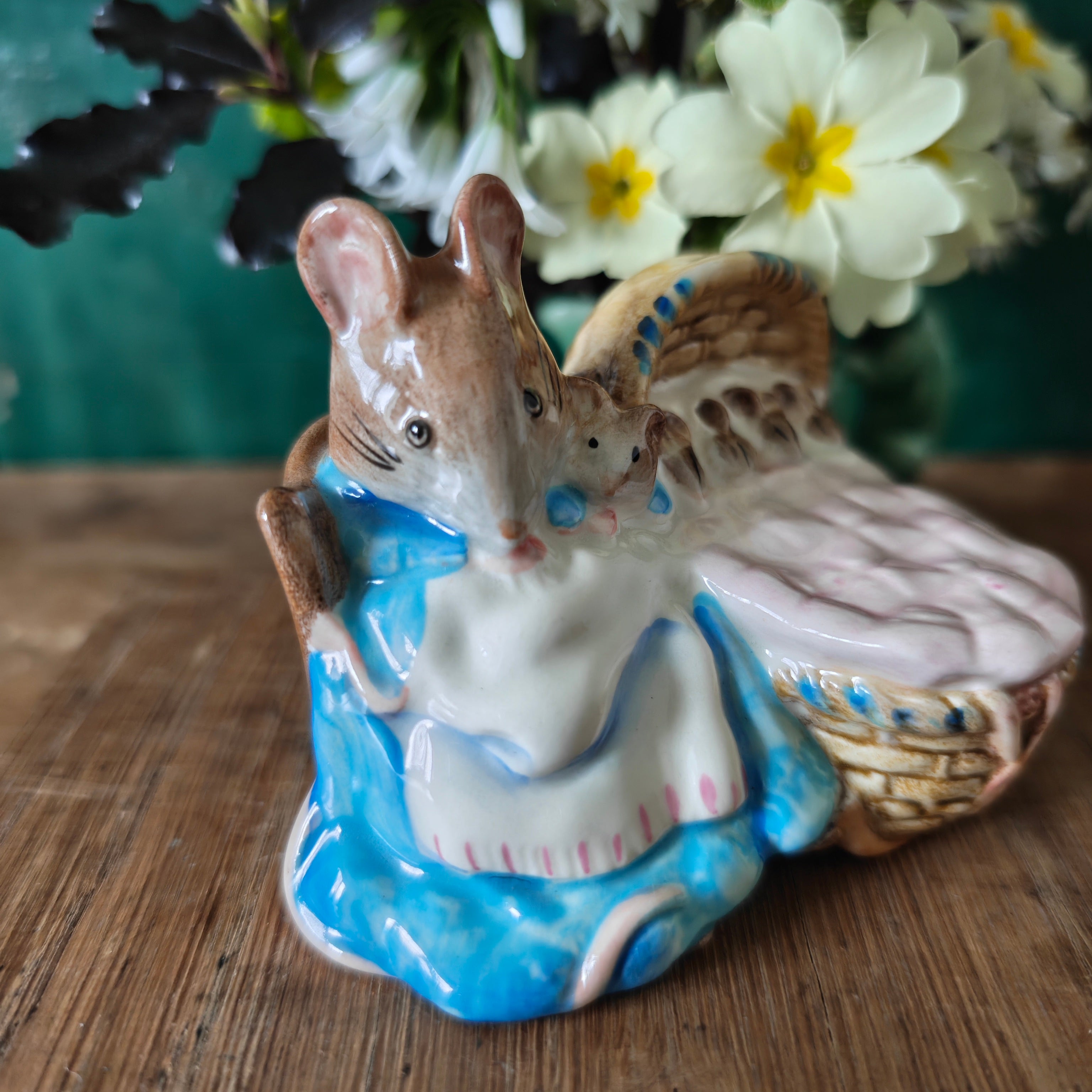 Ceramic mouse figurine with a baby mouse in a blue dress