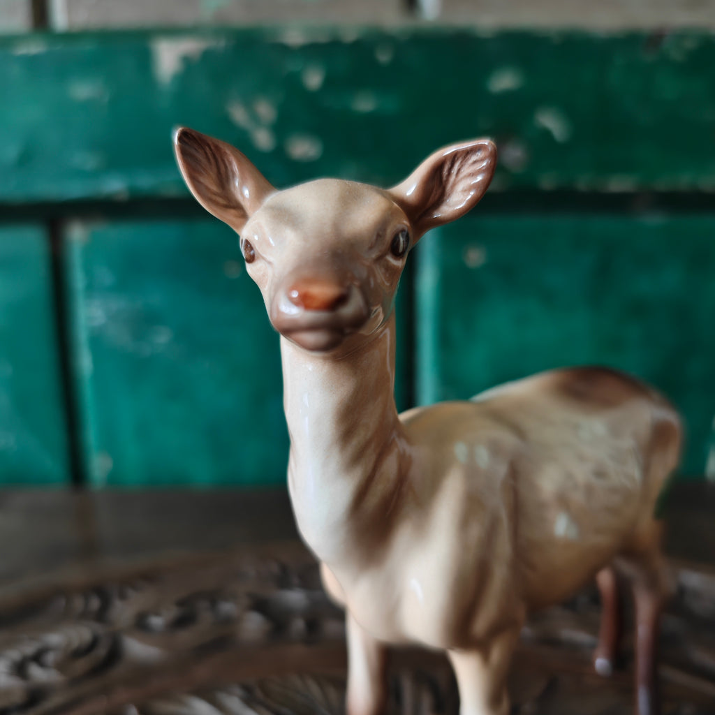 Close up of the head of a deer figurine