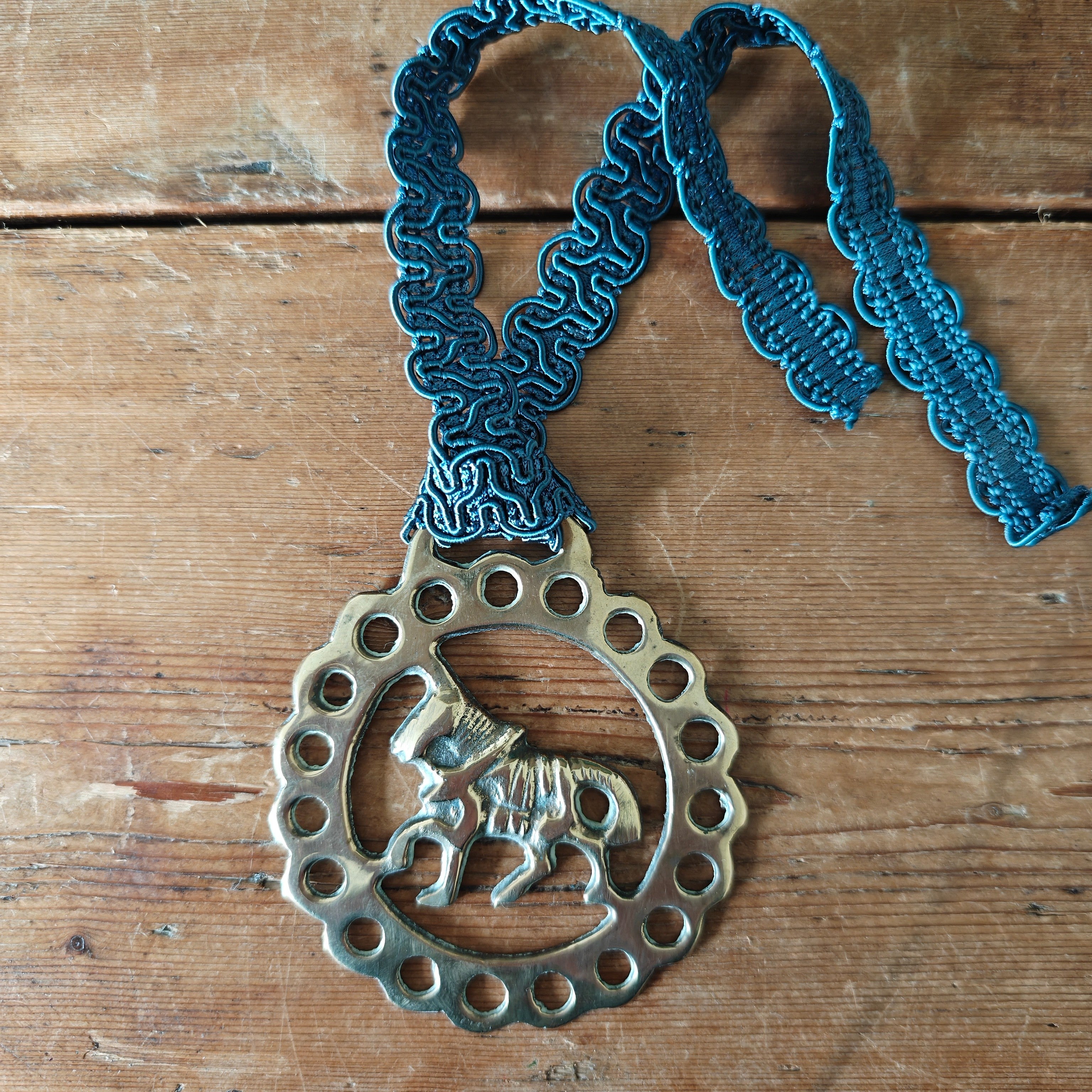 Horse brass with horse design