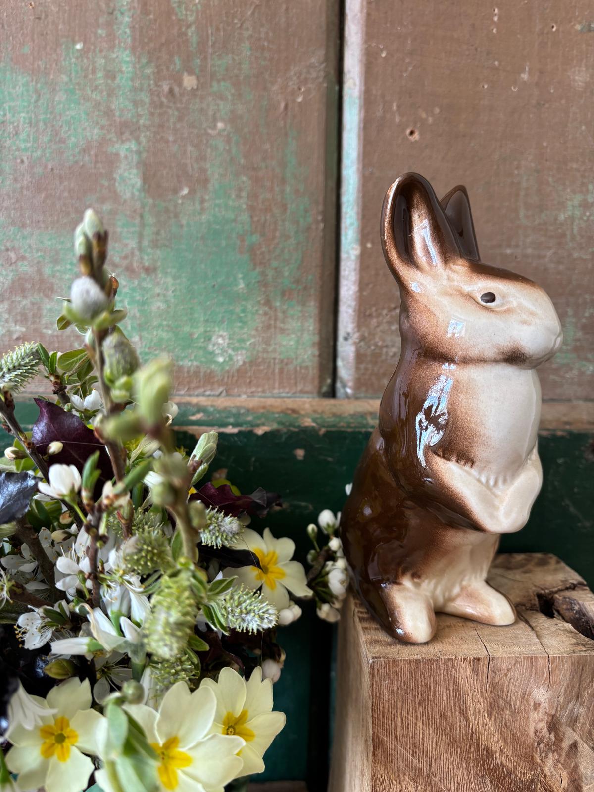 Ceramic rabbit figurine standing on hind legs